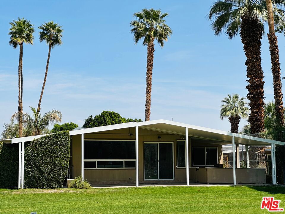 Welcome to 425 Paseo Laredo... an amazing opportunity to own in Date Palm Country Club - the Coachella Valley's premier 55+ golf community. This large, open-concept, contemporary home features 3 bedrooms & 2 bathrooms. It's offered fully furnished / turn-key. Move right in and start enjoying all the area has to offer. In addition to the stunning views of the green space & mountains, you'll enjoy the large updated kitchen & breakfast area, the formal dining room, perfect for entertaining, the great room w/ widescreen screen TV, two renovated baths, impeccable interior design and new flooring throughout, indoor laundry, the very private lanai w/ pet-friendly fencing, ample parking, and more! Close to shopping and restaurants, Date Palm Country Club is the place to call home. Schedule a tour today!