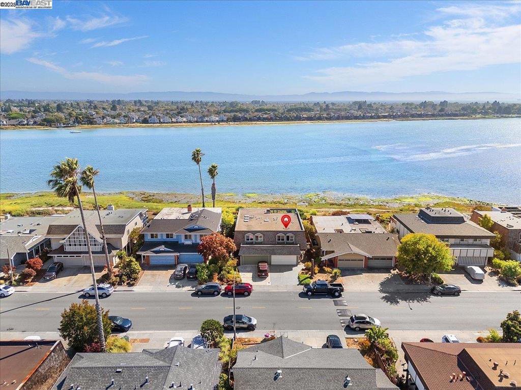 Life by the Bay has never held more promise. This 3-bedroom, 2.5-bath home offers the perfect opportunity to create a space that reflects your style while enjoying one of Alameda’s most coveted settings. With a little vision and care, this fixer-upper can be transformed into a dream home that takes full advantage of its surroundings. Step outside and you’re greeted with scenic walking trails and the San Francisco Bay just moments away. From the primary suite, soak in sparkling skyline views of San Francisco — a daily reminder of the world-class city right across the water. Evenings invite sunset strolls along the shoreline or cozy gatherings at home with the Bay as your backdrop. Practical perks meet possibility with a 2-car garage plus additional driveway parking and a flexible floor plan ready to be reimagined. Outdoor spaces offer the chance to garden, entertain, or simply relax and take in the coastal air. And then there’s Alameda itself — a community celebrated for its top-rated schools, easy ferry and transportation options, and a vibrant mix of shops, restaurants, and local events. From farmers markets to neighborhood cafés, life here blends small-town charm with big-city access. At 2904 Bayview, it’s not just about the house you’ll create — it's about the lifestyle.