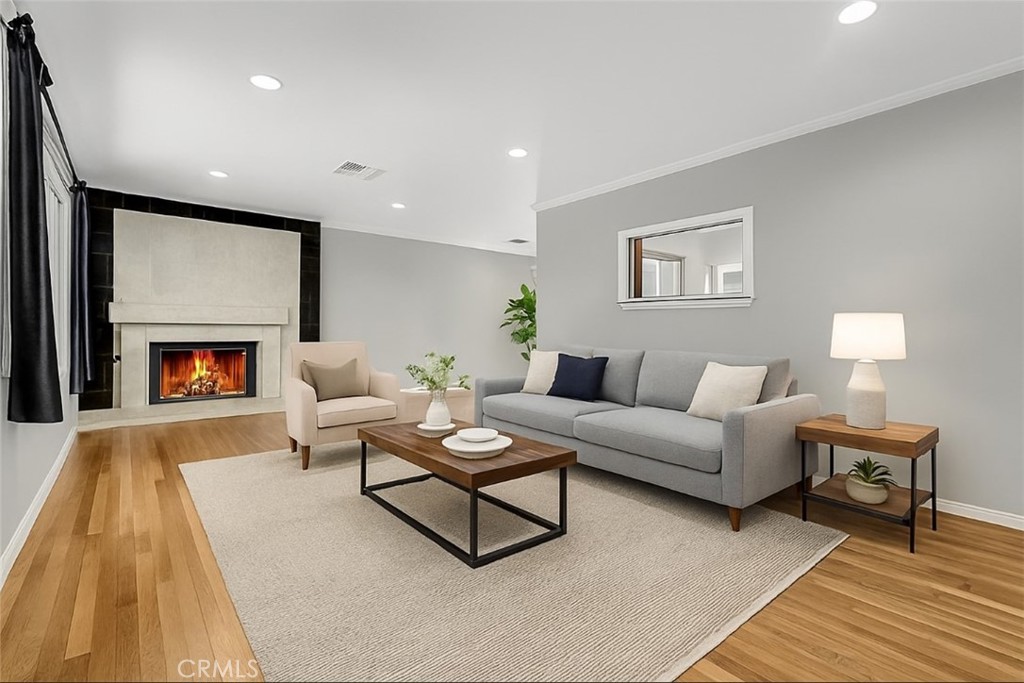 A One-of-a-Kind Private Sanctuary in Canoga Park
Boasting approximately 1,900 square feet of total living space, this unique 3-bedroom, 2-bathroom home includes both a permitted sunroom and a converted garage, offering flexible options for living, working, or hosting. Tucked away behind soaring ficus hedges, custom wrought-iron fencing, and a secure electric gate, this extraordinary residence is a rare find—offering unmatched privacy, comfort, and potential on one of the most spacious lots in the area.
From the moment you arrive, it’s clear this is not just another home—it’s a lifestyle retreat, thoughtfully designed for those who value security, space, and serenity. Set on an expansive 8,135 square foot lot, this fully gated property welcomes you with ample off-street parking for four or more vehicles—including space for an RV—all tucked safely behind the electric gate.
A timeless clay tile roof crowns the home, while fresh interior and exterior paint create a crisp, move-in-ready canvas. Inside, the inviting layout features gleaming hardwood floors, a striking marble fireplace in the living room, and a bright, open kitchen appointed with granite countertops and tile flooring.
The permitted sunroom, adorned with travertine tile, provides peaceful extra living space with tranquil views of the lush backyard—perfect for morning coffee or evening unwinding. A garage conversion offers valuable bonus space for a home office, studio, or guest suite.
The rear yard feels like your own private park, with a manicured lawn, two covered patios for al fresco entertaining, and a rare collection of mature fruit trees—avocado, orange, lemon, peach, and apple—creating a personal orchard right at home.
Modern upgrades add comfort and peace of mind, including a new automatic sprinkler system, a recently installed central AC unit, and an upgraded 200 AMP electrical panel. Located within walking distance to local schools, yet tucked away in its own secluded world, this home offers the best of both convenience and privacy.
With its combination of space, security, and long-term potential—including ample room to build a standalone ADU—this gated Canoga Park gem is truly one of a kind. Don’t miss the chance to own something rare, special, and entirely yours.