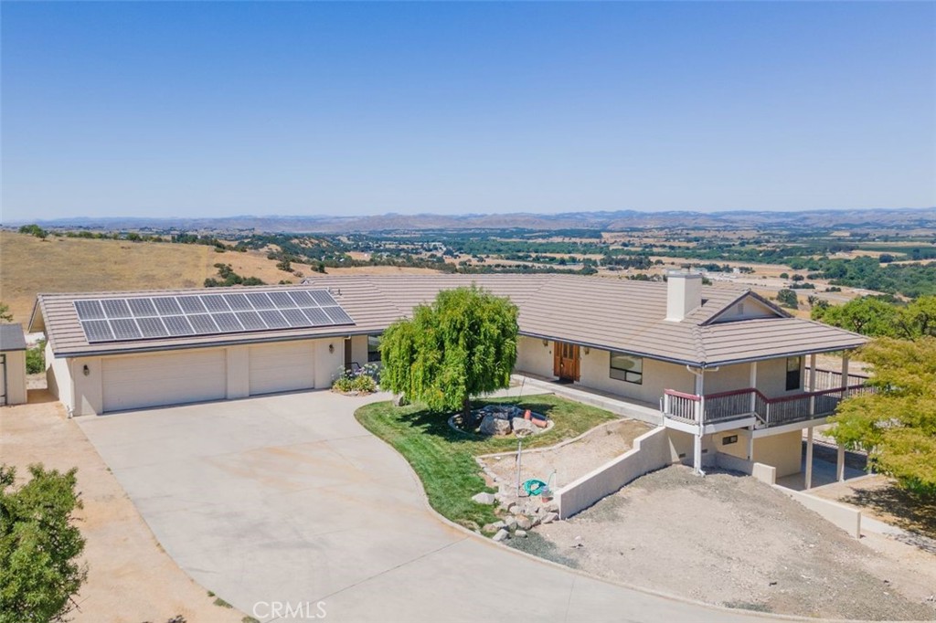 If you're searching for panoramic views overlooking the Salinas valley and space to spread out in a country atmosphere, this home on 5 acres could be exactly what you are looking for. The sunken living room features several large windows that frame the outstanding views of the surrounding countryside.
The large country style kitchen has a center island and its own dining area. The owned solar system is perfect for those who appreciate country living with modern comforts and there is a backup generator installed to keep the home powered in the event of a power outage. This fine property also features a three car garage and large decks for additional outdoor living spaces. The property was thoughtfully designed for comfort and functionality, and is just minutes from Paso Robles's charming downtown, world-class wineries, scenic vineyards and all the beauty of Central Coast living. Contact your agent for a private viewing.