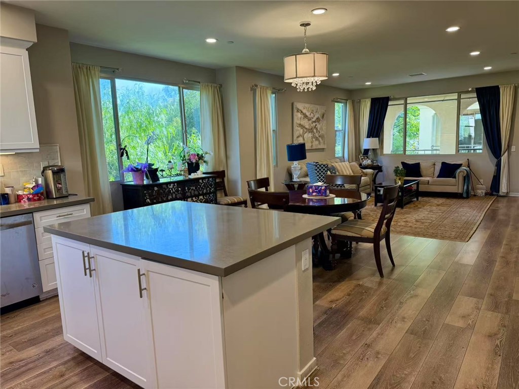 Welcome to this gorgeous home in the charming Dahlia Court community of Trabuco Canyon. Ready to Move In - Furnished, Refrigerator, Washer and Dryer INCLUDED! This immaculate 4-bedroom, 3.5-bathroom condo offers the perfect blend of comfort, style, and convenience. This home features a light-filled living area with soaring ceilings that make the space feel even more open and expansive. The thoughtfully designed floor plan creates a natural flow, perfect for both relaxing and entertaining. The gourmet kitchen features sleek quartz countertops, stainless steel appliances, and crisp white cabinetry that adds a touch of elegance. Just off the kitchen, you'll find a cozy balcony where you can unwind with your morning coffee or enjoy a peaceful evening breeze while taking in the neighborhood and mountain views. Upstairs, the spacious primary suite is your personal retreat, complete with a ceiling fan, generous walk-in closet, and a spa-like bathroom with dual vanities and a stunning walk-in shower. The three other bedrooms are equally inviting and ideal for guests, a home office, or whatever suits your needs. Additional highlights include an EV charger and a tankless water heater in the spacious 2-car garage. Located in a desirable area close to award-winning schools - walking distance to Santa Margarita Catholic High School, supermarkets, and fantastic dining options, this home also offers easy access to The Toll Roads for added convenience. Enjoy breathtaking views of snow-capped mountains in the winter and sunny beach days just a short drive away in the summer. This is a home you don't want to miss!