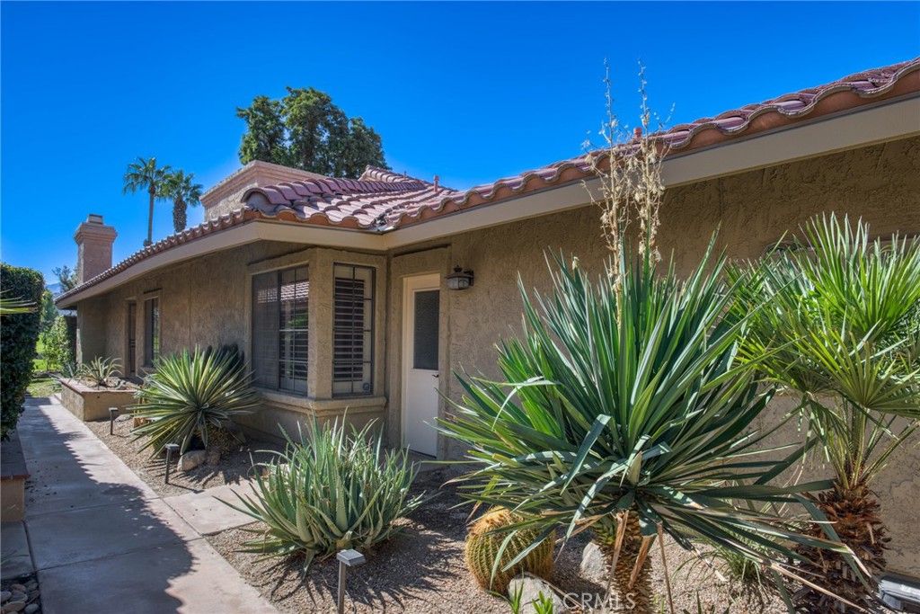 Photo of 77751 Woodhaven Dr N, Palm Desert, CA 92211 (MLS # IV25243362)