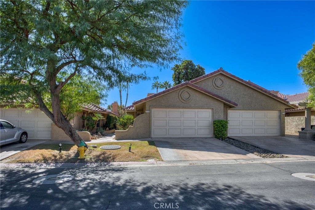 Photo of 77751 Woodhaven Dr N, Palm Desert, CA 92211 (MLS # IV25243362)