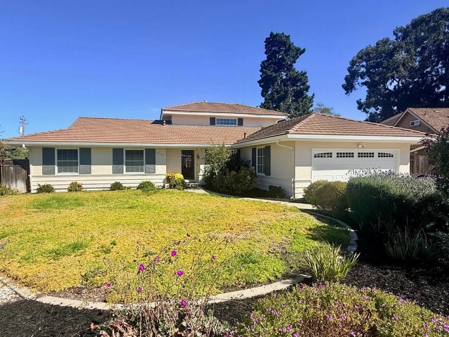 Set on a grand lot in Toro Park Estates, this 5-bedroom, 3-bath home offers a perfect blend of privacy, flexible living space, and a truly self-sustaining garden. The desirable floorplan features 3 bedrooms and 2 full baths on the main level, with 2 additional guest rooms and a full bath upstairs. The heart of the home is an updated kitchen equipped with stainless steel appliances, a Blue Star chefs gas range & oven, RO system, granite countertops, large pantry & a sunny breakfast nook. The formal dining area opens to a generous living room overlooking the expansive private back yard.   Every detail has been thoughtfully enhanced, from new flooring throughout to fresh interior and exterior paint, double-pane windows, & slider doors that welcome natural light. All 3 bathrooms have been remodeled with sparkling marble and stone finishes, Toto toilets, oversized tub & modernized showers.  Step outside to your private backyard retreat featuring a pergola, raised deck, & multiple outdoor living areas. The exceptional lot includes a gated side area with extra parking & a highly productive garden supported by an automatic drip irrigation system producing fruits, vegetables, & herbs that makes this home beautifully self-sustaining. Near Toro Park Center shops, dining, and local services.