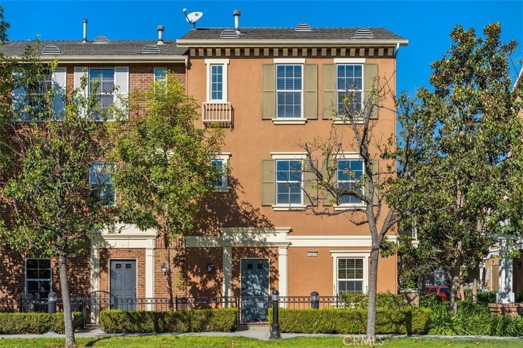 WELCOME HOME to this stylish and spacious townhome in the desirable Columbus Square community of Tustin Legacy! This bright and open floor plan features beautiful hardwood flooring, plantation shutters, and tasteful upgrades throughout. The expansive gourmet kitchen boasts granite countertops, rich cabinetry, stainless steel appliances, and an oversized breakfast bar—perfect for casual dining and entertaining. The inviting great room offers a cozy fireplace, custom built-ins, and walls of windows that fill the space with natural light and overlook the private greenbelt. Upstairs, the luxurious primary suite includes a spa-inspired bathroom with dual vanities, soaking tub, separate shower, and a generous walk-in closet. Additional highlights include convenient indoor laundry, direct-access 2-car garage, and a large private courtyard for outdoor enjoyment. Residents enjoy resort-style community amenities including a clubhouse, pool/spa, parks, playgrounds, and sports courts—all just minutes from The District, Irvine/Tustin Marketplace, top-rated schools, dining, and entertainment. Don’t miss this opportunity to lease in one of Tustin’s most sought-after neighborhoods!