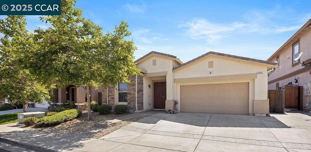 Tucked in a peaceful neighborhood built in 2012, this beautifully updated 4-bedroom, 2-bath home delivers the perfect blend of style, comfort, and everyday convenience—on a spacious 6,742 sq ft lot with no HOA to worry about. With brick accents and a low-maintenance front yard, the home makes a striking first impression and continues to impress inside. Enter into a light-filled open layout where the living and dining areas flow effortlessly, enhanced by tile flooring and an inviting sense of space. The kitchen is a true centerpiece—outfitted with stainless steel appliances, a central island for casual meals, and two oversized pantry closets for all your storage needs. It overlooks a cozy family room with a fireplace, perfect for movie nights or hosting friends, with sliding doors leading to the backyard for easy indoor-outdoor living. Down the hall, the spacious primary suite offers views of the backyard, a ceiling fan for comfort, a generous walk-in closet, and an ensuite bath with dual vanities. Two additional bedrooms share a serene full bath, while a fourth bedroom at the front of the home is perfect for guests or a private home office. A dedicated laundry room with built-in cabinets and a two-car garage with driveway parking completes the home. The expansive backyard is a