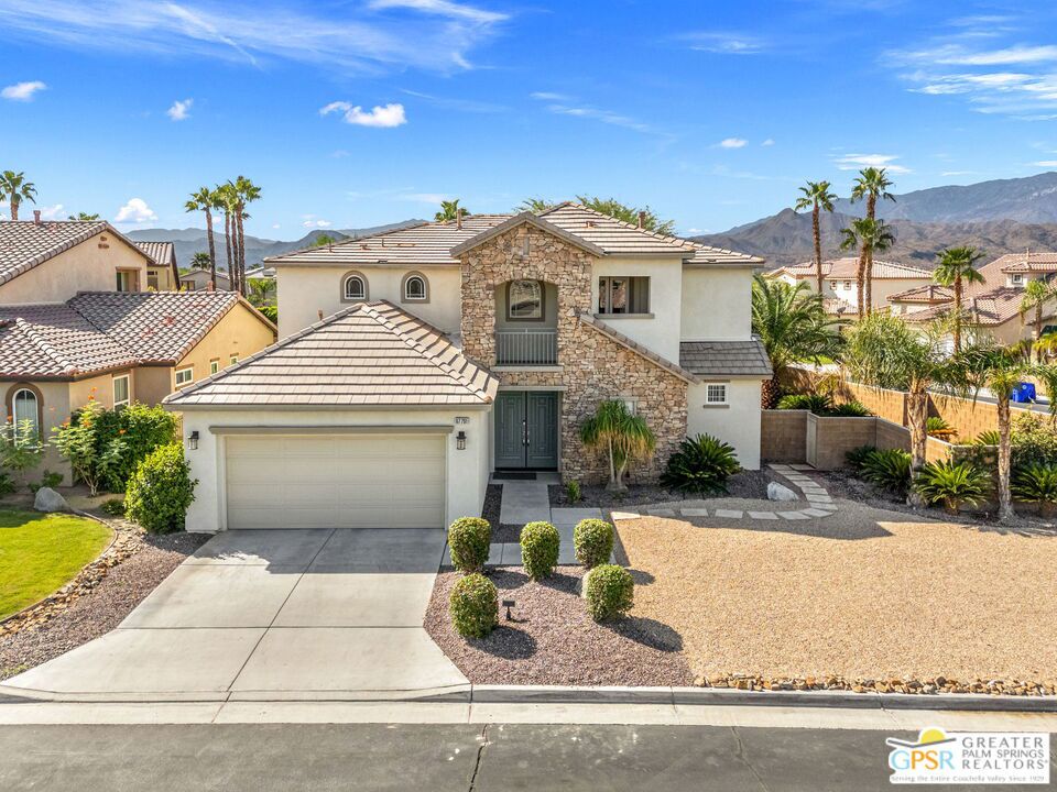 Nestled within the secure, gated community of Cimarron Cove, this four-bedroom, three-bath home is designed with families in mind. With 2,283 square feet of living space and a 6,970-square-foot lot, there is room to grow, play, and create lasting memories. Inside, soaring ceilings, fresh paint, and new vinyl plank flooring set the stage for comfortable living. The open-concept kitchen, dining, and living room make family time effortless, while French doors and natural light create a bright and welcoming atmosphere. The kitchen is both practical and stylish, with resurfaced cabinetry, ample storage, a water pot filler, built-in desk, and modern appliances. A first-floor bedroom with its own entrance is ideal for extended family, a playroom, or a live-in caregiver. Families will value the home's efficiency and comfort: two brand new air conditioning systems keep the home cool year-round, while a leased solar system with 26 panels and 13 years remaining reduces energy costs to an average of just $160 per month. Additional upgrades include a newer refrigerator and dishwasher (2023).Outdoors, evenings can be spent gathered around the fire pit, enjoying backyard mountain views free of wires, or hosting friends under the covered seating area by the fountain. Cimarron Cove provides resort-style amenities children and parents alike will enjoy pool and spa, basketball court, park with playground, BBQ areas, and optional RV storage. Safety comes first with secured gated access and a roving patrol. Located near Cimarron Golf Resort and with easy access to CV Link, this home offers the perfect blend of convenience, community, and comfort - an ideal environment to raise a family.