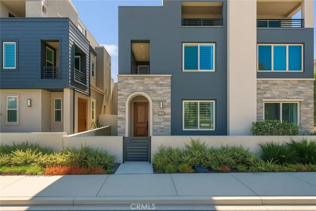 GREAT LOCATION! In Irvine’s highly desirable Great Park Neighborhoods Solis Park, this beautifully designed residence combines modern archetectual style, ample natural light.
The open-concept floor plan features a spacious great room that blends living and dining areas, with wide-plank luxury vinyl flooring, designer finishes, and recessed lighting create a warm and inviting atmosphere throughout.
The kitchen rested in the center of the house, with a large quartz island with bar seating, custom soft-close cabinetry, a designer tile backsplash, and a suite of GE Monogram stainless-steel appliances.
Upstairs, the primary suite with a walk-in closet and a spa-style bath with dual vanities and a tiled shower with the three additional bedrooms provide comfort and versatility. The best thing is the third-floor bonus room opens to a private rooftop terrace with scenic mountain views, ideal for a home office, gym, or game room.
Additional highlights include plantation shutters, a private outdoor patio, a whole-house air filtration system, fully paid solar panels, and an attached two-car garage.
Residents enjoy access to Solis Park’s resort-level amenities, including pools, spa, BBQ areas, outdoor kitchens, playgrounds, and walking trails. Zoned for top-rated Solis Park Elementary and Portola High School, both located within the community.
Experience the best of Irvine living in one of Orange County’s most dynamic master-planned communities!