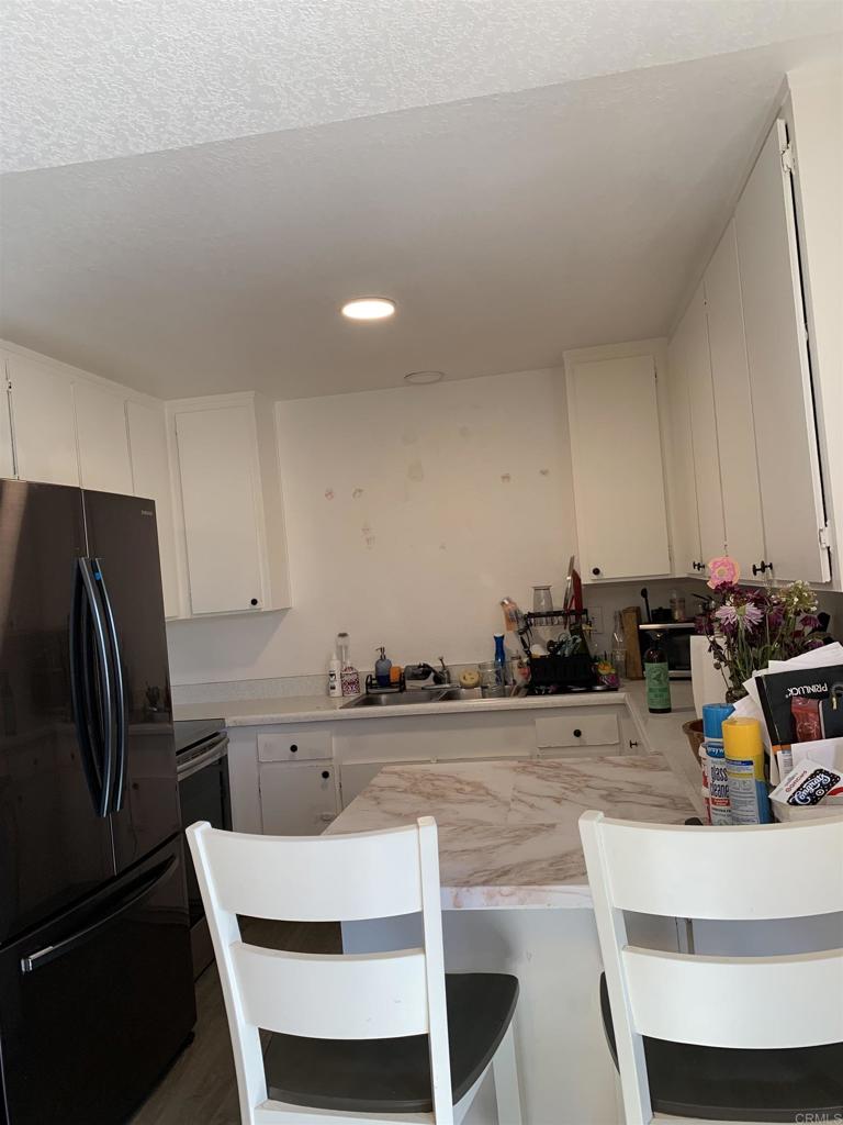 Great Condo - Beautiful downstairs - Corner unit. Freshly Painted - Open area with a spacious Kitchen with dining area. Newer flooring - Spacious Primary Bedroom - Great space ( 12 x 16 Approx. ) 2nd Bedroom has a murphy Bed that will stay. The community Laundry has recently been remodeled. Parking in the back # 15. Smaller complex with 20 units... RAMONA - a country living atmosphere !