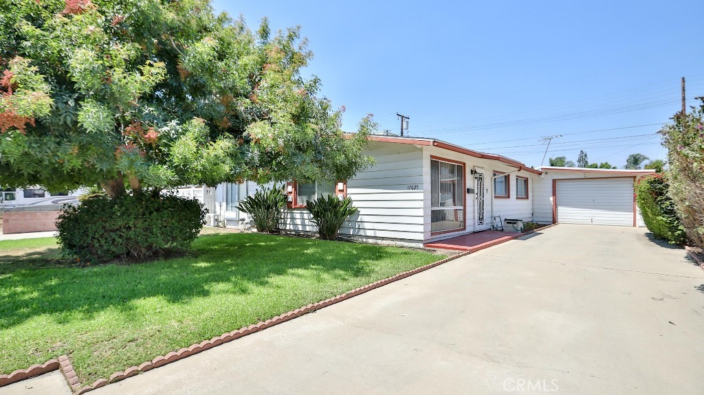 Charming Covina classic on a generous lot! This 1954 single-family home offers 4 bedrooms, 2 baths and approx. 1,196 sq ft of interior space on a ~7,050± sq ft parcel—plenty of room to garden, entertain, or explore ADU possibilities (buyer to verify). Inside, you’ll find a comfortable, flexible layout with four true bedrooms that easily accommodate guests, office, or playroom needs. The expansive backyard is the star—ideal for weekend BBQs and outdoor living. A rare drive-through garage with doors on both sides provides easy access to the yard for vehicles, projects, or storage. Two garden ranch sheds by Tuff Shed add organized storage, and a Generac generator provides convenient backup power. Convenient, commuter-friendly location near local schools, parks, dining, and daily conveniences. A great opportunity to personalize and make it your own! Buyer to verify all information.