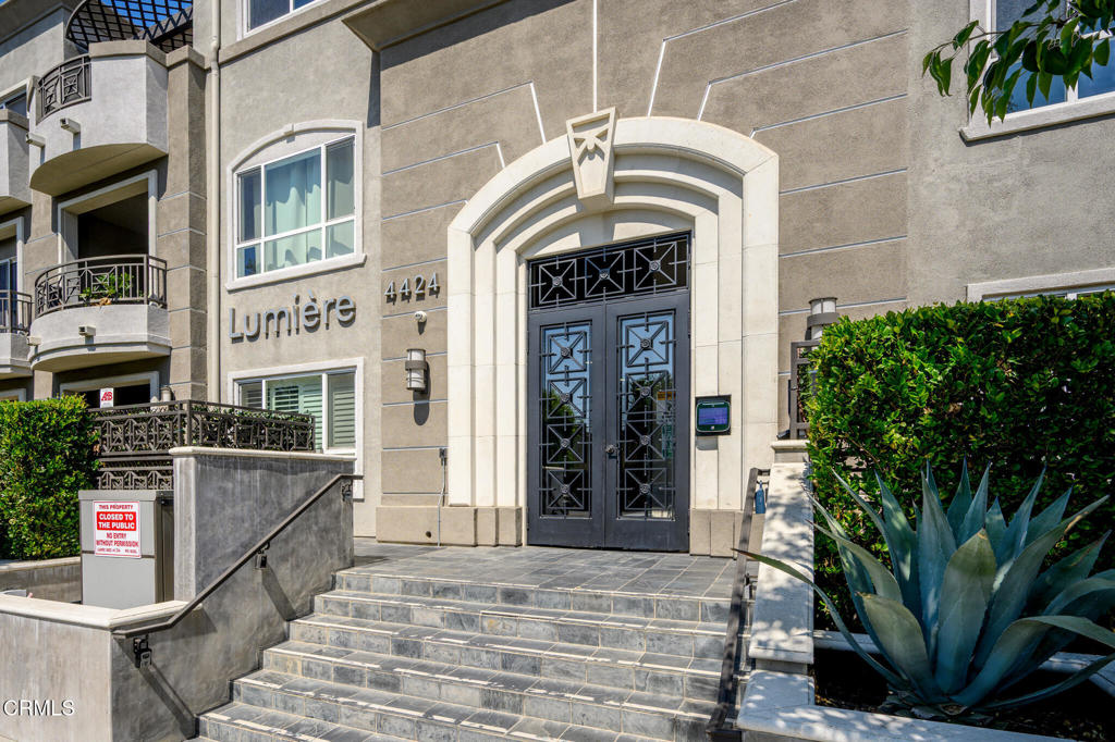 Price Reduced and Sellers will credit $10,000 towards Buyer's non-recurring closing costs with acceptable offer! Experience refined living with this meticulously maintained 2-bedroom, 2-bath condo in the heart of Studio City. Built in 2009, the home blends modern comfort with thoughtful architectural detail. Dark engineered wood floors lay a rich foundation beneath plantation-shuttered sliding doors that open to a private balcony. A stately light-stone fireplace anchors the room with warmth and character. The gourmet kitchen is designed for both beauty and utility. Dark wood cabinetry pairs with granite counters, while Electrolux Icon stainless appliances--including fridge, cooktop, microwave, and dishwasher--elevate everyday cooking. A center island offers extra prep space and easy flow into the adjacent dining area. The primary suite is a peaceful retreat with soft carpet, dual closets, and direct balcony access. Its spa-style bath includes a marble double vanity, deep soaking tub, and a glass-enclosed marble shower--delivering comfort in clean, modern lines. The second bedroom offers generous closet space and easy access to the full bathroom with a shower-over-tub design and quality finishes. A dedicated laundry closet accommodates a stackable washer/dryer. Enjoy the convenience of two designated parking spaces within the garage. For the eco-conscious, the HOA permits the installation of an electric car charger, adding significant value and future-proofing. Additionally, residents may install dedicated storage space within the garage, providing extra room for belongings. Beyond the unit itself, the building offers exceptional common area amenities that elevate the living experience. Unwind in the beautiful courtyard featuring a serene water feature and a cozy fireplace--an ideal spot for quiet reflection or casual gatherings. Fitness enthusiasts will appreciate the impressive multi-room gym, equipped with a variety of machines and its own private bathroom, making it easy to maintain an active lifestyle without leaving home. Located in a highly sought-after Studio City neighborhood, this condo offers unparalleled access to a vibrant array of shops, acclaimed restaurants, entertainment venues, and cultural attractions. With its prime location, modern design, and an abundance of amenities, this property presents an exceptional opportunity to experience the best of Southern California living. This is more than just a home; it's a lifestyle!