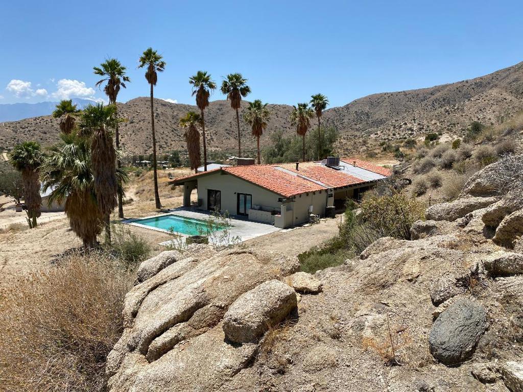 RARE OPPORTUNITY! Pool Home and Horse Property up high on a hillside overlooking Morongo Valley featuring incredible views and privacy! The home, garage, breezeway and patios are all under one roof. Three bedroom, two bath, large great room with an open kitchen plan. Laundry room is inside for easy use. Morongo Valley is approximately 20 minutes from Palm Springs, Pioneertown and Joshua Tree. Temperatures are cooler than the low desert plus you will realize the open space and peaceful nature of the area when you arrive. San Bernardino County has short term rental policies requiring a permit. This property could be an incredible opportunity for a very private short term vacation rental. The exterior was just freshly painted.