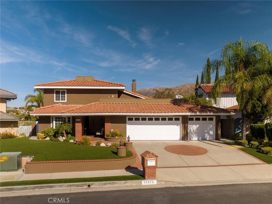 Welcome to this beautifully designed 5-bedroom, 4-bathroom pool home that perfectly blends luxury, comfort, and functionality. Nestled in the desirable Porter Valley Estates, this spacious residence features a main-level bedroom with a private en-suite bath, ideal for guests or multi-generational living. A separate powder room adds convenience for visitors. Step into the heart of the home, an expansive chef’s kitchen complete with upgraded flooring, generous storage and counter space, including a huge island with wine storage, perfect for entertaining or family meals. The open-concept living and dining areas flow effortlessly to the backyard oasis, complete with a sparkling pool and spa, and breathtaking views creating your own private retreat. Upstairs, you'll find the additional well-appointed bedrooms and bathrooms including a spacious primary suite with ample closet space and custom walk-in shower. Whether you're hosting gatherings or enjoying a quiet night in, this home offers the perfect setting for every lifestyle. Conveniently located near the Porter Valley Country Club, with easy access to the 118 freeway, hiking trails, shops and restaurants. This home truly has it all!