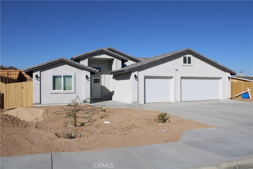 Brand New Construction Welcome to this beautifully nearly finished, brand-new 4-bedroom, 3-bathroom home, offering 2,222 square feet of modern comfort and thoughtful design. This floor plan includes two primary suites, making it ideal for multi-generational living, guest accommodations, or simply extra space and flexibility. Located on a desirable neighborhood with other recently sold new builds by the same trusted builder, this home is crafted with quality features and attention to detail. Inside, you’ll find soaring ceilings, recessed lighting, and large windows that fill the home with natural light, creating a bright and airy atmosphere. The spacious kitchen is a true highlight, complete with quartz countertops, custom cabinetry, an oversized island with extra storage, an undermount sink, and a generously sized pantry—perfect for entertaining or everyday living. Each bedroom includes mirrored closet doors and ceiling fans for added comfort, while the indoor laundry room offers plenty of cabinetry and convenience. Step outside to your covered patio—an inviting space for morning coffee or evening gatherings. Additional highlights include: 3-car garage with full-size concrete driveway , Fully fenced backyard with RV parking, Landscaped front yard, All-electric home with paid-off solar system for energy efficiency and cost savings, Wi-Fi capable garage doors and water heater.
Please note: Photos shown are of similar homes built recently by the same builder. The new model may feature slight variations but will maintain the same quality and style. Don’t miss the opportunity to own this stunning new home. Schedule your private tour today!