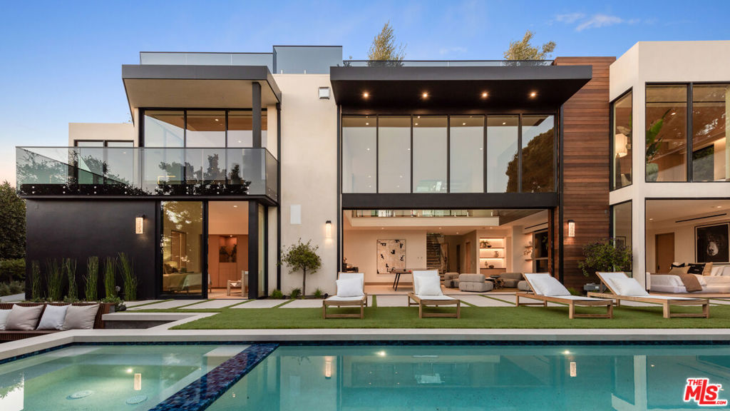 The apex of modern sustainable luxury has arrived in the prestigious Pacific Palisades Riviera. Completed in 2024 with the highest attention to detail, this elevated California Contemporary oasis was designed to seamlessly integrate indoor/outdoor living while maximizing light and views stretching from mountain and city to Santa Monica Bay and Will Rogers State Park. Set behind gates this property encompasses 6 bedrooms, 10 baths, a home office, a separate guest house/wellness center and multiple entertaining spaces that offer moments of tranquility amidst nature. Layered and textured materials harmoniously blend with sleek lines and walls of glass that open to views, lending to subtle warmth and fluidity throughout. Entertain in the open light-filled great room, dining area, and entertainer's kitchen anchored by an 18-ft. Belvedere stone island, a secondary kitchen, a 300-bottle wine room, and wrap around balconies. Descend to the lower floor boasts an inviting home theater and secondary family room/game room with fireplace, elegant bar and soaring 22-ft. ceilings complemented by expansive glass doors that open to the private backyard and infinity-edge pool. Take the elevator to the rooftop terrace with a fire pit, lounge, outdoor kitchen, and "forever" views. The main floor primary suite provides another point of connection to nature with an outdoor view terrace and is appointed with a fireplace, a coffee bar, two walk-in closets, and a luxurious Taj Mahal stone bath. Fully sustainable and tech-forward, this Smart Home features the top tier Luxury Home Automation, Lutron lighting system, solar panels, Tesla Powerwall batteries, and EV charging. A 3-car garage, carport, and parking for up to several vehicles behind the gate ensures both convenience and security. A coveted hillside setting in Pacific Palisades, one of L.A.'s best coastal neighborhoods near Brentwood Country Mart, shopping, restaurants, and places you near beaches, hiking and biking trails, and top-tier schools.