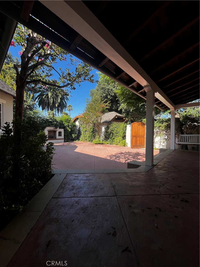 Welcome to this bright and beautifully updated home nestled on a quiet cul-de-sac street in the highly desirable city of La Cañada. Located just a short stroll from local stores, including CVS, Verdugo Hills Hospital, Montrose Shopping Park, and much more, this home offers both charm and convenience. Set on a large lot, this artistically designed retreat boasts a perfect blend of comfort, style, natural beauty, and exceptional detailing. Step inside to a spacious patio courtyard, leading to an open-concept family room filled with natural light, highlighted by a large picture window with tranquil views of the lush yard. The expansive living room invites relaxation with its cozy fireplace and generous layout. The kitchen features granite countertops, warm wood cabinetry, and opens to a spacious dining area—ideal for cooking, entertaining, and gathering with loved ones. The courtyard offers ample entertainment space, complete with an outside fireplace and a serene backyard, where you can enjoy views of surrounding greenery in a peaceful, retreat-like setting. This space is perfect for a vegetable garden, a play area, or simply unwinding under the sun. Additional features include gleaming hardwood floors, central air, and heat, inside and outside fireplaces, separate laundry room, and two separate garages. This home is perfect for families seeking a warm, welcoming community with top-rated schools and friendly neighbors. Do not miss this rare rental opportunity in one of La Cañada's most sought-after neighborhoods!