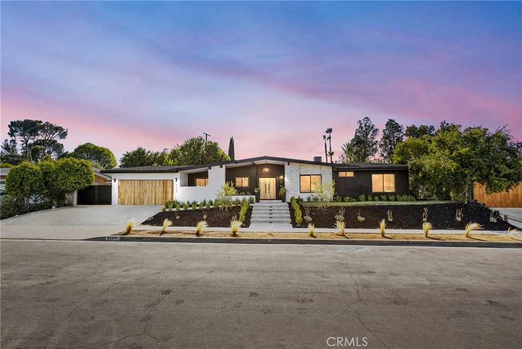 Nestled on a tranquil tree-lined Street, this masterfully restored, single-story Charles Dubois home offers an unparalleled living experience. Located in one of the most highly desirable Woodland Hills neighborhoods of Woodland Hills , you'll enjoy close proximity to award-winning schools, exceptional shopping and entertainment at The Village, The Commons in Calabasas, and some of the best restaurants around. From the graceful entry adorned with mature trees to the alluring zen-like yard with Mountain Views this home embodies true California living. With an extensive high-end renovation in 2025, this residence has been carefully restored and transformed into a chic and stylish showstopper with Lots of Curb appeal, Privacy Double Gated Side Entry can be used for RV / Auto parking seamlessly blending Modern design with modern comforts. Upon entering, you are greeted with the interior Foyer living area featuring Open Spacious Floor plan and a cozy Art piece Mid Century Modern fireplace, and an amazing view of the lush front yard with its brand new, New pool /Spa / Baha and Lounge area
perfect for year-round entertaining. The interior is thoughtfully arranged with open living and dining spaces in mind. The newly remodeled kitchen, complete with European-style custom wood cabinets and a stunning center island Chefs Kitchen provides the perfect setting for entertaining. Adjacent to the kitchen is an expansive dining room with a fireplace, large windows, and sliding doors that lead to the breathtaking backyard oasis. This home also features a large family room and Custom Wine room area holding up to 52 bottle creating an ideal space for casual gatherings. The Living and Dining rooms open directly to the backyard, enhancing the indoor-outdoor flow. In the backyard, you'll
find a custom-built Large Patio with a dining area inside, perfect for alfresco meals. The backyard also boasts a Large freshly laid Sod Grassy yard with ample space for relaxation or entertaining. There are four bedrooms with on suites for each bedroom including the primary suite, which features an exquisite bath, custom tiles and a custom built walk-in His/ Hers closets and and Sliding door that open to the Pool & Lounge area and enjoy a great view of the gorgeous pool & Mountains views Tranquil and very private backyard with custom barbecue and entertainment area. Dont miss your Chance to make it yours!