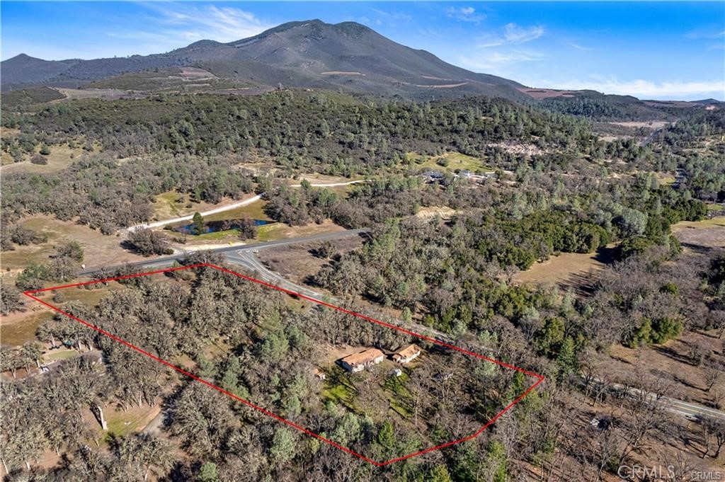 Great opportunity to own 5+ usable acres with a manufactured home close to downtown Kelseyville. 3 bedrooms, 2 bathrooms, on well and septic. If you want to have lots of pets, farm animals and have plenty of parking for RV, boat etc. This property has it all! 2+ acres on both sides of Brower Ln. (possible lot split, check with Lake County building department) Close to downtown Kelseyville and easy Highway 29 access. Plenty of room if you want to build another home.