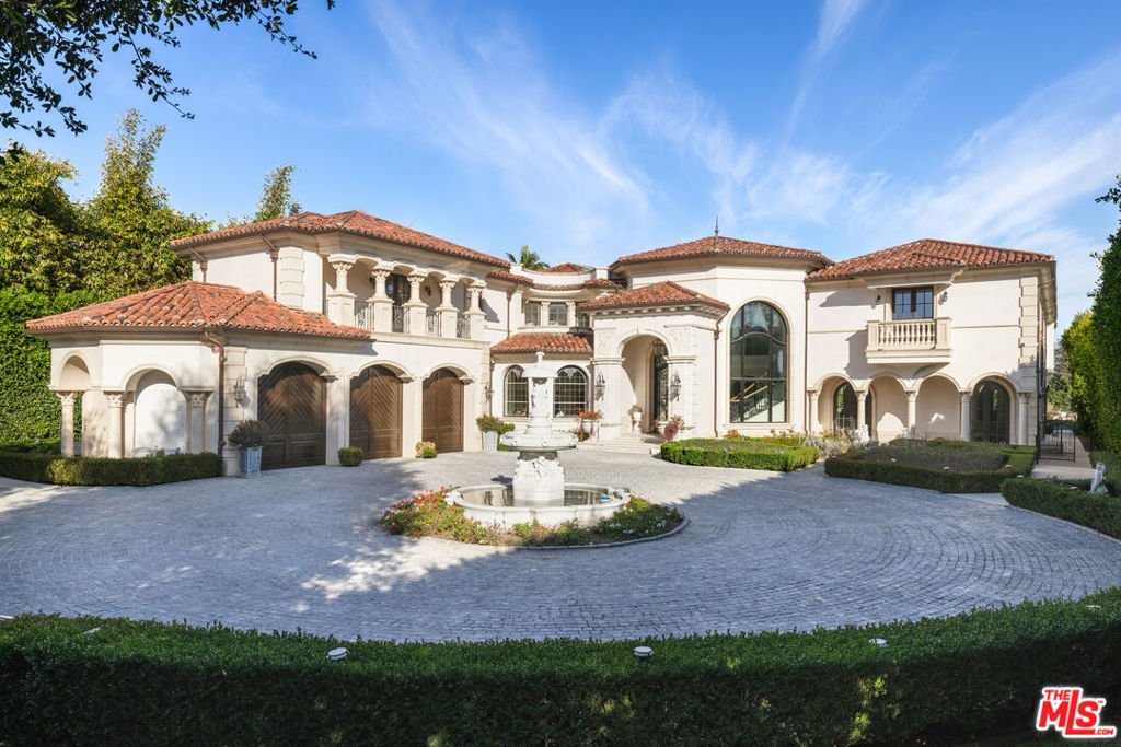 Grand Italian compound nestled on approx. 2 acres of land with city views in the heart of Brentwood. Situated on the largest lot on lower Tigertail Rd., this generational estate presents a rare opportunity for lease. Featuring immense scale, a gated circular motor court, 23-foot ceilings, a sprawling lawn, multiple covered outdoor patios, a 54-foot pool and spa, a full tournament-sized tennis court, a gazebo, a vineyard, and much more, this property is truly exceptional. Upon entry, you are greeted by a dramatic, double-height foyer that seamlessly flows into an open formal living room, flanked on one side by the formal dining room and on the other by the theater, billiards bar, and card room --- ideal for entertaining. The gourmet kitchen, complete with top-of-the-line appliances, adjoins both the family room and a sunlit breakfast nook. Completing the interior are dual primary suites, four additional en suite bedrooms, an office, and an elegant library. Rarely does an estate of this stature and pedigree become available.