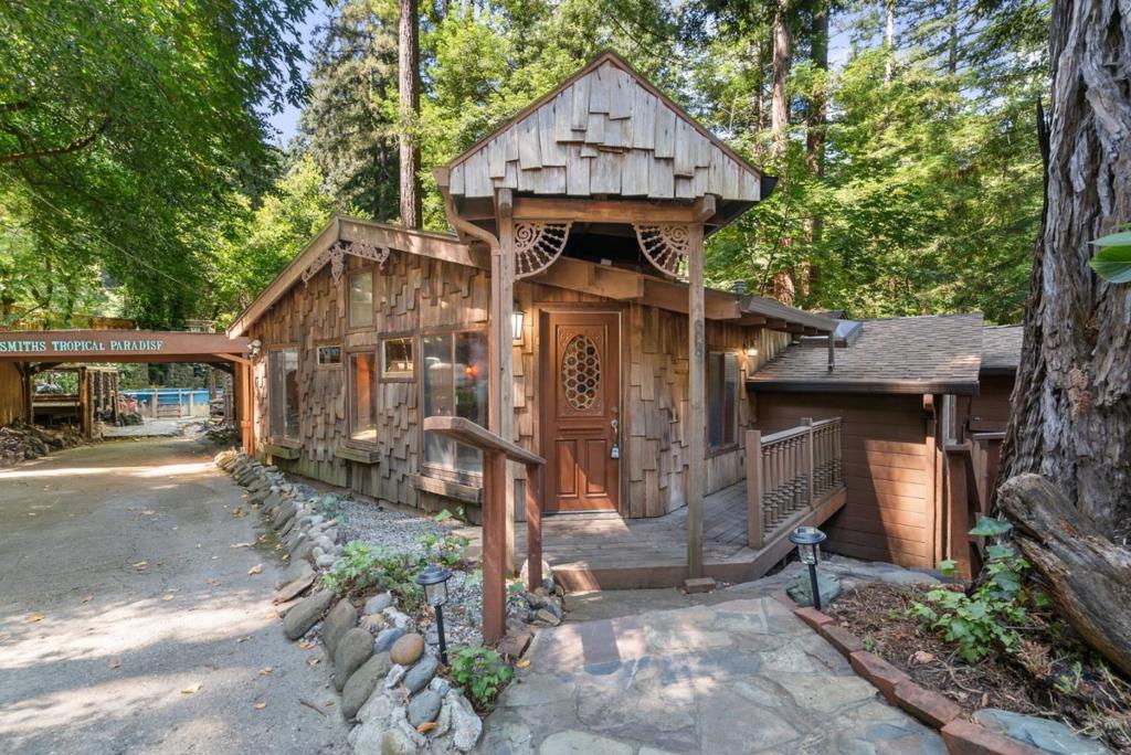 Nestled along the tranquil banks of Zayante Creek, this quirky and character-filled property is a hidden gem bursting with opportunity. Set on a spacious oversized lot, this unique creekside oasis features an above-ground pool, detached studio, and a generous back deck that leads down to the water, perfect for relaxing or entertaining in a serene natural setting. With a rich history and eclectic charm, the home has been expanded over the years adding almost double the square footage, offering a flexible layout and plenty of room for a fresh new vision. Whether you're looking to renovate, restore, or reimagine, this property is a dream canvas for the creative buyer. Enjoy privacy and convenience with a gated entry, ample parking, a carport, and mature trees surrounding the lot. This is your chance to create something truly special in a peaceful, nature-rich locationdon't miss out on the many possibilities this one-of-a-kind property has to offer!