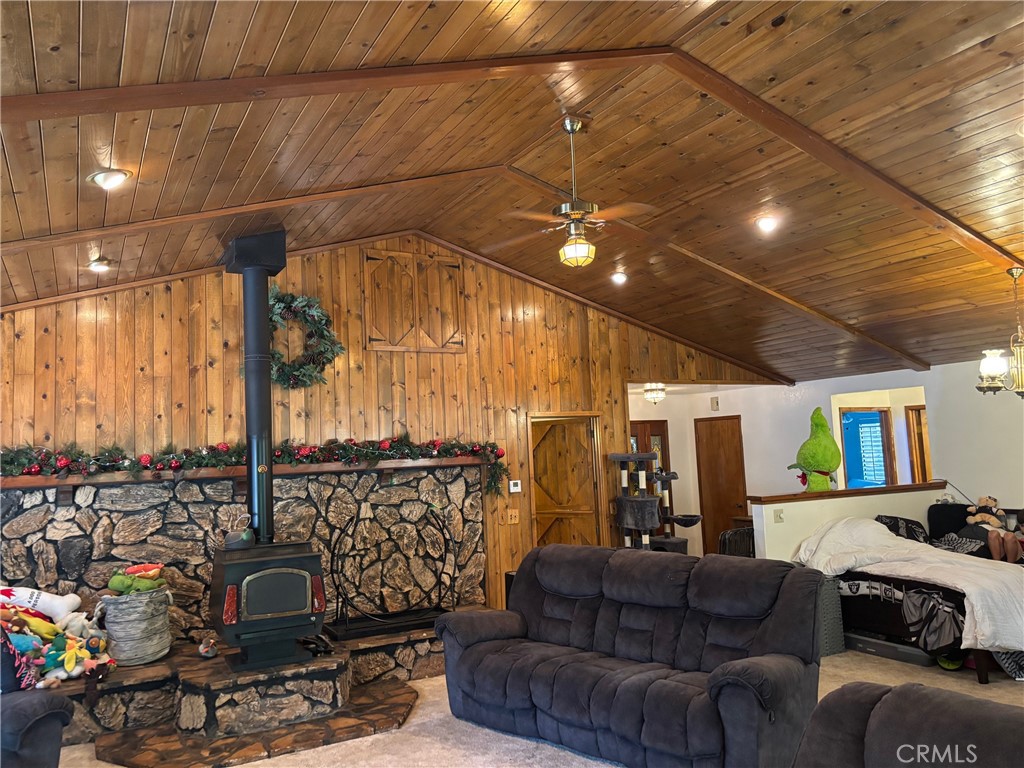 Spacious Home on 3 Private Wooded Acres with Shops, Workshop, and More
Tucked away on a serene 3-acre wooded lot, this expansive home offers the perfect blend of comfort, function, and rustic charm. Step inside to an open floor plan with soaring vaulted ceilings and a spacious living room centered around a cozy wood stove with a stone hearth and surround. Just off the living room, French doors open to a sun-drenched, three-season sunroom—ideal for relaxing or entertaining year-round.
The large kitchen is a dream for home chefs, featuring ample cabinetry, dual sinks, and a sunny breakfast nook. A staircase from the living room leads down to a concrete patio complete with a covered spa and gazebo with abundant seating—perfect for enjoying peaceful forest views.
Attached to the home is a 3-car garage with an adjacent 600 sq. ft. heated workshop, plumbed with an air compressor. Above the workshop is a large unfinished bonus room with its own entrance—ideal for a future ADU, guest quarters, or game room.
Across the driveway, you'll find a spacious metal shop with a concrete floor and two 14-foot roll-up doors—perfect for RVs, boats, or automotive projects. Additional amenities include an RV shelter with extra storage, a wood storage barn, and a Generac generator that powers the home automatically during outages.
In addition to a private well, the property includes access to ditch water which fills a 1,400-gallon storage tank for irrigation and fire prevention.
And did I mention the new above ground pool equipped with lights and fountains!
This is a rare opportunity to own a versatile and well-appointed home in a peaceful, forested setting with room to live, work, and play—all just a short drive from town.