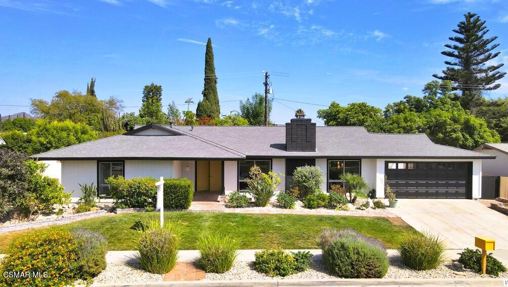Welcome to 1558 Norwich Ave.! - a stunning 5-bedroom, 2-bathroom, 2,065 sq ft mid-century modern style home located in the highly sought-after Shadow Oaks neighborhood of Thousand Oaks. This gem boasts charming curb appeal, a classic double-door entry and beautifully blends timeless design with modern updates. Step inside to find Spanish tile flooring, exposed beam ceilings, stylish light fixtures, bold accents and floor-to-ceiling windows that bathe the home in natural light. The inviting living room features a large brick fireplace--perfect for cozy evenings. Enjoy the spacious kitchen offering quartz countertops, stainless steel appliances, a farmhouse sink, breakfast bar, recessed lighting and unique folding kitchen windows that create a seamless indoor-outdoor flow--ideal for entertaining with a convenient pass-through to the backyard. The primary suite is a private retreat showcasing an updated ensuite bathroom. Four additional bedrooms (one with a large glass slider leading to the backyard), a beautifully upgraded guest bath, laundry room with ample storage and a direct-access 2-car garage complete the thoughtfully designed interior. Outside, relax in your very own backyard oasis with a sparkling pool, sun deck, garden with lemon & peach trees, a detached air-conditioned workspace/art studio (with a window) as well as plenty of space to unwind. Centrally located near shopping, dining, award-winning schools, parks, hiking trails and more - welcome home! *Additional amenities include - freshly painted interior/exterior, solar, newer HVAC/ducting & plumbing.