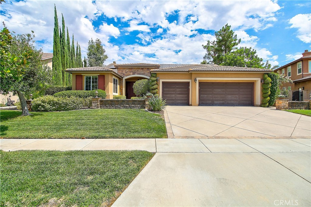 ***Beautiful Single-Story Pool Home in South Corona*** Welcome to this stunning 4-bedroom, 2.5-bath single-story home, complete with a professionally hardscape front yard and an attached 3-car garage. Nestled on a generous 15,682 sq. ft. lot in one of South Corona’s most sought-after neighborhoods, this home offers an open, bright, and elegantly upgraded living space. Inside, you’ll find wide hallways, crown molding, gleaming wood flooring, and newer carpet in all bedrooms—creating a warm and inviting atmosphere throughout. The fully remodeled kitchen is the heart of the home, featuring a large center island, quartz countertops, new stainless steel appliances, a 5-burner stove, and a walk-in pantry with custom cabinetry. It flows seamlessly into the spacious family room, complete with a cozy fireplace and built-in media center—perfect for relaxing or entertaining. Enjoy separate formal living and dining areas, as well as a versatile office with custom built-ins that can easily be converted into a fifth bedroom. The luxurious primary suite serves as a true retreat, offering a spa-inspired bathroom with a soaking tub, walk-in shower, and a custom walk-in closet. Step outside into your own private backyard oasis. The oversized, fully hardscape space features a sparkling pool, shaded patio cover, freestanding gazebo, and privacy-enhancing stone fencing—ideal for entertaining or unwinding. A separate shed adds extra storage. Additional highlights include fully paid-off solar panels, a two-year-old high-efficiency AC unit, a whole-home water purifier, and thoughtful custom-built-ins throughout. Located in a top-rated school district, this home perfectly combines comfort, style, and energy efficiency in a premier location. This home is a true Gem-offering an oversized lot and premium upgrades rarely found together. Don't miss out!