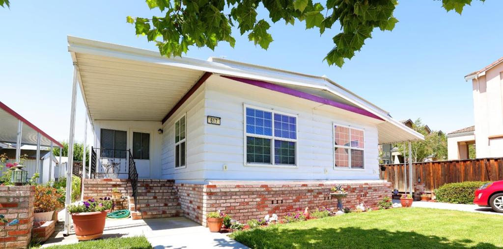 See this beautifully maintained 1974 home with approx. 1,674 Sq. Ft. , 3 rooms, and 2 bathrooms. As you enter the home you will be greeted by a stunning living room. The dining area is absolutely lovely with a display cabinet, skylight, and unique light fixture. This home also has a great family room with a skylight. The kitchen is perfectly equipped with a refrigerator, microwave, dishwasher, stove, and oven. Not only that but, it also has an eat-in kitchen, a pantry, and an illuminating skylight. The master bedroom has a beautiful mirrored closet. The master bathroom has a separate tub and shower and double sinks. For your laundry needs, the laundry room has both a washer and dryer. A/C cooling and forced heat are also included. The exterior encompasses a screen room and a wonderful BBQ area. Parking will not be a problem with a carport with space for 3 cars. Lastly, this home is located near shopping, dining, and more!
