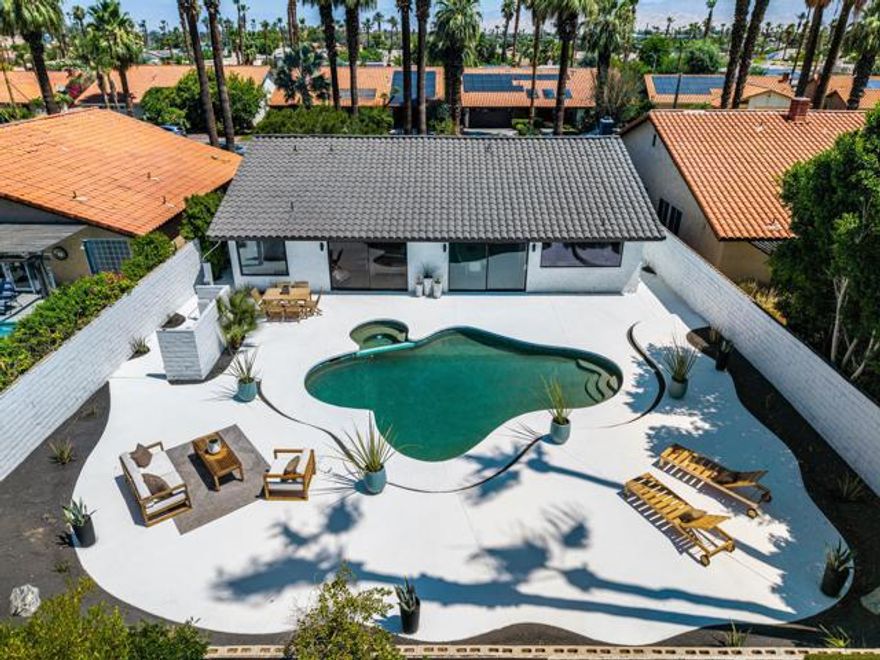 Fully custom home within a quiet, no HOA neighborhood-offering a combination of privacy and convenience, just moments from the heart of Rancho Mirage & Palm Springs. You are welcomed with a 30-ft marble stone walkway that sets the tone of high-quality design of the home. Step down as you reach the living space, the open-concept floor plan impresses with vaulted ceilings, smooth-finish drywall with a spray paint finish, and wide-plank white oak LVP flooring. Perfectly situated on a large north to south lot, the space is comfortably filled with natural light during the day and enhanced by dimmable LED recessed lighting at dusk. Thinking of adding an ADU? This is the perfect large, interior lot. The chef's kitchen is a true centerpiece, featuring a professional-grade ZLINE dual fuel range, a sleek waterfall-edge oversized island with a built-in wine fridge, and a stunning 10-foot architectural window showcasing breathtaking backyard views. Custom white oak cabinetry with 9-ply birch boxes and drawers, luxury quartz countertops by Tile Designs by Fina, European brass fixtures, and a limestone backsplash complete this gourmet kitchen. Custom designed by Nicholas Lawson, a Coachella Valley local designer. Retreat to the primary suite with an en-suite bathroom featuring 360-degree designer tile, walk-in shower featuring dual solid-brass tower faucets, picture window with a view of the private backyard, copper penny tile flooring with copper glass grout. Both bathrooms feature a large walk-in shower, smart toilets with bidets and auto-open, and double sink vanities with solid brass fixtures. Expansive 10-foot sliding glass doors open effortlessly to a private backyard oasis, complete with a sparkling PebbleTech pool, tiered entertaining zones, and a cool-technology coated deck perfect for warm desert days. All of this set against the dramatic backdrop of the San Jacinto Mountains. Additional upgrades include a brand-new 18.5 SEER2 high-efficiency electric heat pump with a 10-year compressor warranty for added peace of mind. Centrally located near sought-after destinations including Cotino - Disney's Storyliving community, world-class golf, upscale dining, and premier shopping, this home delivers luxury desert living with zero compromises. Staging can be purchase