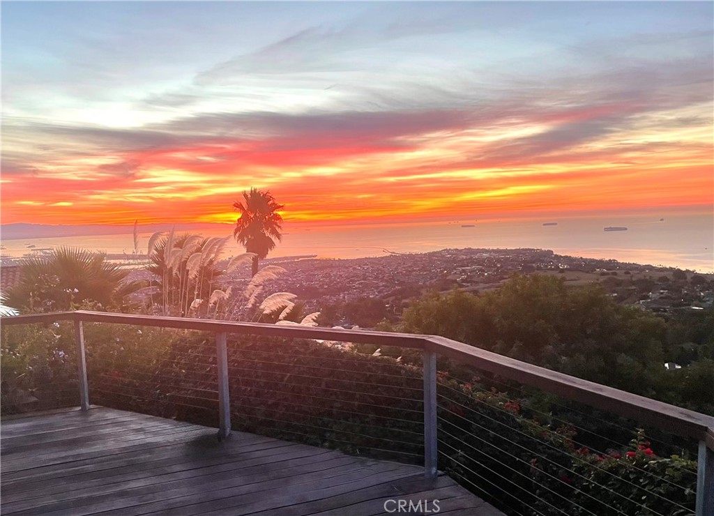 Remodeled with distinction by renowned architect Bob Halderman in 2000 with expansive Catalina and harbor and ocean views. The 2,719 sq ft home sits on a 23,670 sq ft lot with a custom 1,700 sq ft wrap around viewing deck that is complimented by lush landscaping creating the ultimate first impression. Double doors open to wood inlaid vaulted ceilings anchored by a stone fireplace. The living room with soaring ceilings and secondary fireplace open to incredible views of the ocean and beyond. The gourmet kitchen is equally impressive with massive open beamed architectural ceiling that set the tone for the culinary experience. Casual sitting is framed in by walls of glass and complimented by a cantilevered fireplace perfect for cozy winter evenings. The master wing is equally unique with a sitting area, fireplace and double glass French doors leading to the exterior deck to take in all the views. The spa inspired master bath enjoys a jacuzzi tub, separate shower, double sinks and plenty of storage. A secondary master is positioned with double glass doors that access the amazing massive viewing deck. Additional features include office/ laundry room, sky lights, tons of storage, and numerous fruit trees. A completely private and secluded estate set within 6 minutes from the 110 freeway. Residents have access to the top-ranked Palos Verdes Schools such as Mira Catalina Elementary, Miraleste Intermediate, and your choice from two of the top ranked high schools in California. Minutes away, you can enjoy a game of golf or dine at Terranea Resort.