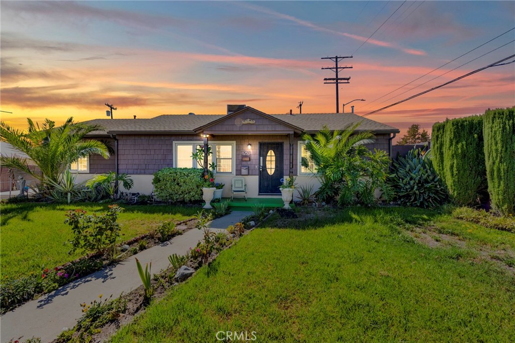 Welcome to this inviting 3-bedroom, 2-bathroom home tucked away at the end of a peaceful cul-de-sac in North Hollywood. Resting on a large 7,765 SF lot, this 1,199 SF residence offers a great floor-plan, thoughtful updates, and undeniable pride of ownership. A gated entry with an electric iron gate and wide driveway leads to a detached 2-car garage, ideal for future ADU potential, while manicured landscaping, mature trees, and a lush green front yard provide excellent curb appeal. Inside, the open living room seamlessly connects to the dining area, creating a bright and airy space filled with abundant natural light. The layout flows beautifully, enhanced by recessed lighting and double-paned windows throughout. The kitchen combines charm and function with granite countertops, a classic backsplash, and rich wood cabinetry. Each bedroom is well-sized and features its own ceiling fan, while the spacious primary suite includes an en-suite bathroom for added comfort and privacy. The home also offers modern conveniences such as central AC and heat, solar panels, and a large laundry room with extra storage. Step outside to an entertainer’s backyard, complete with a covered patio, beautiful green lawn, concrete areas for gatherings, a large Tuff shed, and an additional covered space behind the garage, perfect for storage, hobbies, or a workspace. Located near the 170 freeway for easy commuting, and just a block away from Strathern Park-Jamie Beth Slavin Park, this property offers both comfort and convenience in a prime location.
