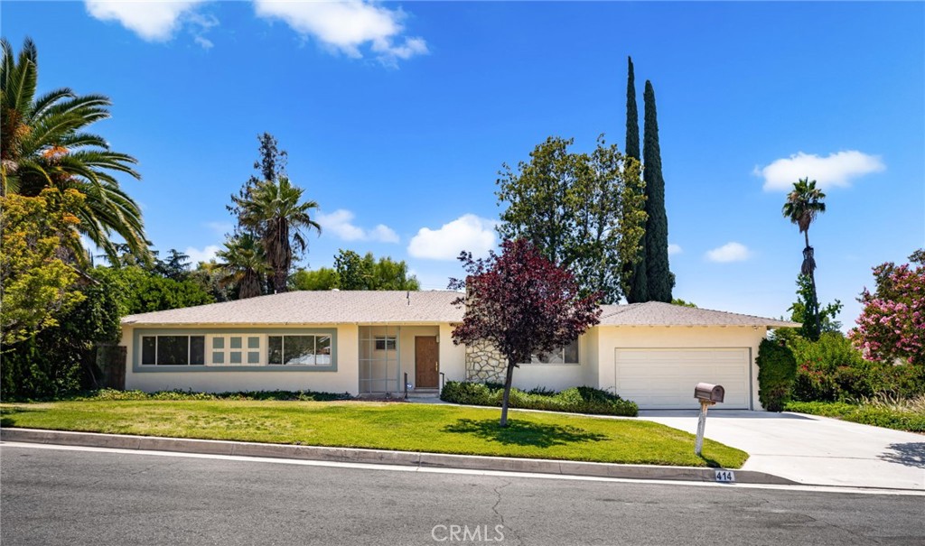 Welcome to 414 Via Vista — a beautifully updated 5-bedroom, 3-bathroom pool home located in a quiet South Redlands neighborhood. This spacious home includes a large addition with its own full bathroom, perfect as a second primary suite, which could be used for multi-generational living, a private guest retreat, or an ADU.
As an added bonus, the seller is offering a $10,000 credit toward buyer closing costs; a fantastic opportunity to help make this home yours.
Step into the updated kitchen featuring Calacatta quartz countertops, brand-new white oak cabinetry, stainless steel appliances, and an overhang perfect for barstool seating. Two bathrooms have been remodeled with new flooring and vanities; and the primary bath features a freshly tiled walk-in shower.
Enjoy the charm of refinished original hardwood floors and fresh interior paint throughout. The home also features a new garage door and new attic insulation.
The private fenced-in backyard retreat features a refreshing pool, fruit trees, and rose bushes, creating a peaceful oasis just steps from your door. The large covered patio offers year-round outdoor living, perfect for entertaining or relaxing.
This home blends quiet, peaceful living on a serene street with the convenience of easy access to major freeways. Located near Mariposa Elementary School, Prospect Park, and the Redlands Country Club, it’s perfectly positioned in one of South Redlands’ most sought-after neighborhoods. This move-in-ready gem is one you won’t want to miss.