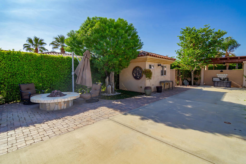 Welcome to Motorcoach Country Club, the desert's premier Class A motorcoach resort, offering world-class amenities, 80 acres of lakes and waterways, a private executive golf course, tennis, pickleball, and a full-service clubhouse with fine dining and bar. Owners also enjoy a vibrant social calendar and resort lifestyle unmatched in the Coachella Valley.This Outdoor Oasis is a beautifully developed privacy lot along the quiet South wall with no afternoon sun in your coach windshield. The property features an expanded paver patio with golf cart parking and synthetic turf, a large pool and spa with waterfall, and a fully enclosed backyard retreat with privacy wall and gate. Outdoor living includes a wooden pergola with custom shades, built-in entertainment center with lighting and overhead fan, and a spacious BBQ island and bar complete with warming drawer, burners, new Blaze refrigerator, new Blaze ice maker, and plenty of storage. A large custom gas fire pit with cantilever umbrella provides the perfect evening gathering spot.The air-conditioned casita offers a new queen Murphy bed, tiled countertops, kitchen sink, abundant cabinetry, and a 3/4 bath with tiled shower--ideal for guests or additional living space.The air-conditioned casita offers a queen Murphy bed, tiled countertops, kitchen sink, abundant cabinetry, and a 3/4 bath with tiled shower--ideal for guests or extra living space.Sellers will include the full $2,020 Food & Beverage Assessment for the 2025-2026 season.*Motorcoach Country Club exclusively accommodates Class A motorhomes from 30' to 45'. Due to zoning, on-site properties are not considered dwellings, and overnight stays inside them are not allowed. MCC's annual Food & Beverage minimum is $2,080.