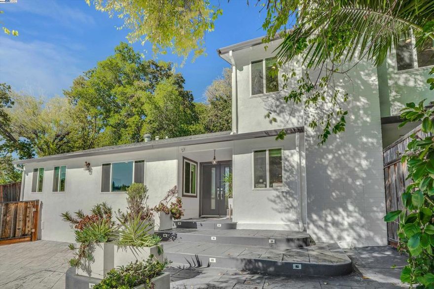 This stunning home for sale is perfect for entertaining! Enter the backyard through the side gate and discover an entertainer’s paradise—an oversized outdoor kitchen with built-in BBQ, pizza oven, wine refrigerator, kegerator, and motorized retractable awning. Enjoy a large synthetic grass play area plus a separate section with a gorgeous pool, swim-up stools, and spa—your own backyard oasis. Inside, this move-in ready home features a chef’s dream updated kitchen with a massive quartz island, custom cabinetry, and high-end stainless-steel appliances, including a six-burner gas range and double ovens. The charming pantry offers great built-in storage and a convenient laundry area. Upstairs, the private primary suite includes a deck overlooking the yard with a gas line ready for a heater. The spa-like primary bathroom features an oversized shower and beautiful modern tile. Downstairs are three spacious bedrooms and a stylish updated bath. Ideally located on a quiet court location within the desirable Lafayette School District near the Walnut Creek border, close to shopping, dining, BART, and commuter routes.