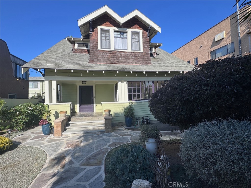 This offering is a rare opportunity to acquire a coastal property with ocean views that can be rented out as a Triplex income property for investment, or as a Single-Family Residence home with additional income from the two apartment units at the back of the lot. There is a 2-story, 1,920 Square Foot, Craftsman Style house built in 1920. The two detached studio cottages, 250 SF each, have their own separate entrance and address. These have been remodeled in recent years. There is a single car garage at the rear of the property.
From Carolina you enter through the gated arbor into the garden courtyard that is landscaped with lush plants and natural stone. There are ocean views from the courtyard and from various rooms inside the 3 bed 1.5 bath home. Features include a formal stone entry that flows into a large family room with an abundance of natural light due to the 10’ high coffered ceilings, and large windows that afford views of the ocean. At the front of the house is an enclosed sunroom off the front porch. Other architectural features are French doors, crown-moulding, original doors and hardware, a fireplace (mantle facade), and loads of architectural charm take you back in time to 1920 when this house was originally built.
The 3 bedrooms and full bathroom are upstairs, with a small room off of one of the bedrooms with views of the ocean that could be used as a home office. The kitchen features hardwood cabinetry, Caesar Stone counters, a Viking 6-burner range and a laundry room off of the kitchen with access to the back yard. An expansive formal dining room with a built-in hutch is off the main hallway adjacent to the kitchen. The interior of the house has been updated over the years while preserving its historic character and exterior curb appeal. A fully remodeled bathroom with a classic hexagon floor tile, porcelain tiled walls, a claw-foot tub, and copper plumbing. There is forced air heating, upgraded electrical breakers, tankless water heater and a pitched roof.
Located near Cabrillo Beach, a top destination for surfing and wind sailing, Point Fermin Park, known for its lively Summer Concerts by the Sea, and the walking path on Paseo Del Mar, where you can enjoy breathtaking ocean views, and bike rides. San Pedro is one of the last affordable Coastal Communities, and values are on the rise with all of the investment in the peninsula and astute investors who see the future potential in the revitalization of this seaside community.
