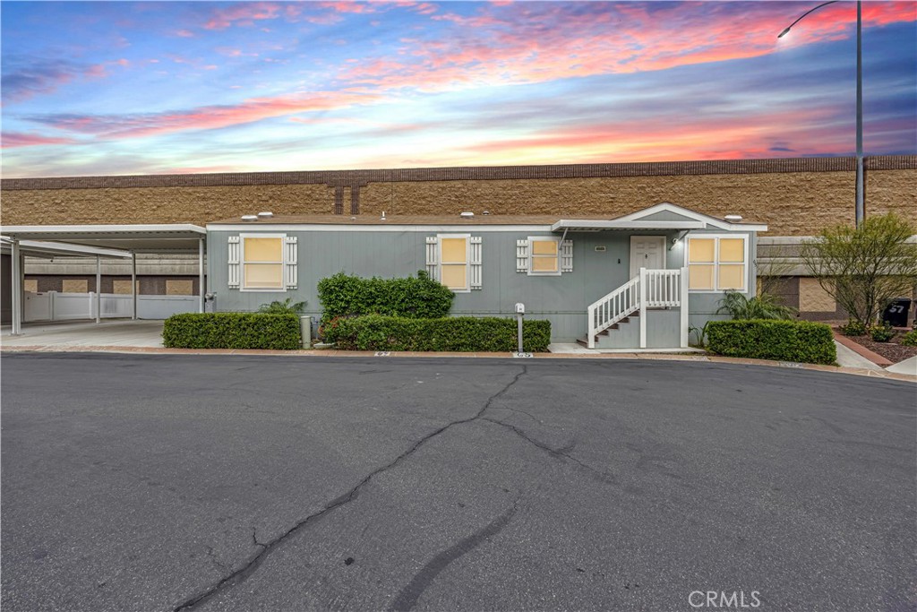 Explore this charming 2020 home located in the Community of Corona West. Spanning approximately 676 square feet, it features 2 bedrooms and 1 bathroom. The living room boasts a combination of carpet and linoleum flooring. In the kitchen, you'll find a refrigerator, stove, oven, garbage disposal, an upgraded single lever faucet, and linoleum flooring. Bedrooms are equipped with ceiling lights, walk-in closets, and carpet. The bathroom includes a single lever faucet, laminate countertops, linoleum flooring, and a tub with a shower. Enjoy a spacious backyard complete with a BBQ area. The utility room also features linoleum flooring. Additional amenities include central A/C and double-pane windows, all conveniently located near shopping centers and more. Come visit today! Monthly space rent is $1,725. This home is REO.