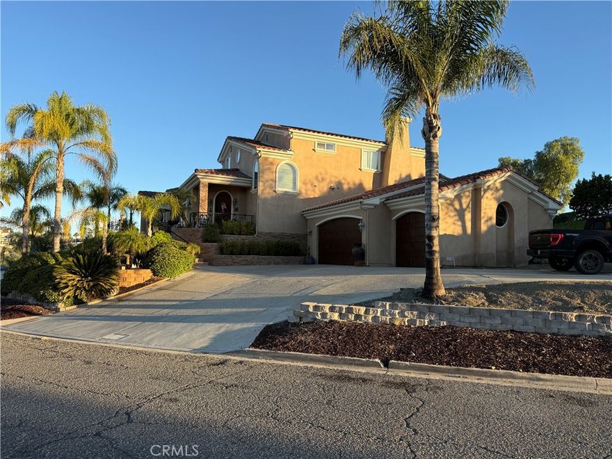 Stunning Custom Build Home in gated community with RV/Boat Parking. 5 Beds/ 4 Bath on the Golf Course! 
30610 Early Round Dr, Canyon Lake, CA 92587 
Stunningly gorgeous MODEL HOME on the 5th hole of the Canyon Lake Golf Course with amazing views, SOLAR, 5 bedrooms with 2 COMPLETE PRIMARY EN-SUITE BEDROOMS DOWNSTAIRS, 2.5 baths downstairs, and 3 FULL BEDROOMS with another FULL BATHROOM upstairs (last bedroom upstairs has a walk-In closet w/private terrace balcony). 2 SEPERATE DRIVEWAYS, one private back driveway entrance, both with RV PARKING! This house is a show stopper and will take your breath away when you come up the flagstone stairway and see the front travertine stone-covered massive front porch with a fire feature! The charm of the "old world" front wood 10-foot front door, and matching 3-car remote-controlled garage greets you. Upon entering this opulent home with crown molding high ceilings, whole house fan, tile/ wood laminate you are greeted by a distinguished front 2 Wine-refrigerator, Granite Bar/TV area. Show-stopping Kitchen with a granite Island adorned with tea lights, double ovens, mic., refrig., and stainless steel sink complimented by walnut-colored cabinets with granite countertops, and opens to your concrete fireplace Great Room with Views of the Golf Course! The living room currently has a pool table with a glass slider that opens to your darling backyard with 2 Gazebos, fire bowls, a fountain, and Jacuzzi with views of the golf course! Downstairs private laundry room. 3 Car Garage has epoxy-poured flooring/built-in cupboards. Upstairs you will find 3 spacious bedrooms and another dual sink tub-shower bathroom.