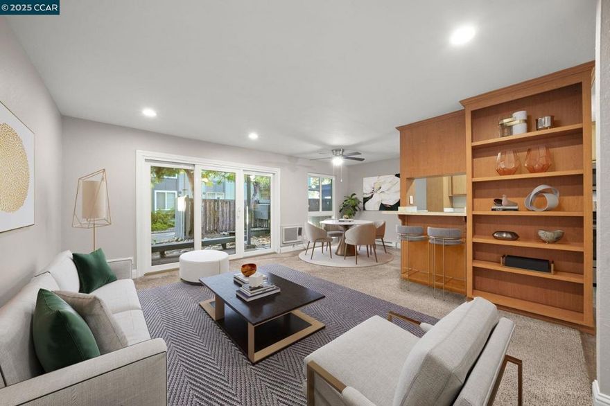 This beautifully updated 1-bedroom, 1-bath, 671 sq. ft. ground-level end unit offers comfort and style throughout. The updated kitchen features quartz countertops along with newer appliances & ample cabinets & opens to casual dining area. Spacious living room offers recessed lighting & slider to patio area. Big bedroom includes a lighted ceiling fan and large closet featuring organized living with built-in closet organizer system.  Updated bathroom with solid surface sink/vanity & large shower with solid surround.  Dual pane windows.  Step outside to your private patio, where you can relax to the soothing sounds of flowing water and watch resident wildlife around the ponds. The community offers a sparkling pool and spa—perfect for hot summer days or unwinding after work. Conveniently located near shopping, schools, freeway access, and BART. Assigned parking space included. Don’t miss this rare opportunity!
