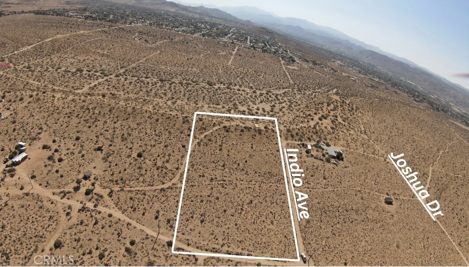 5 Acres | Covington Flats, Yucca Valley. Discover wide-open potential in the serene and sought-after Covington Flats area of Yucca Valley. This 5-acre parcel of raw desert beauty offers a rare mix of peace, space, and convenience. With power lines overhead and water reportedly nearby (buyer to verify), this lot is primed for development—whether you're envisioning a weekend escape, a modern desert retreat, or a full-time homestead under the stars. Enjoy the rural, off-grid feel without sacrificing access: you’re just minutes from downtown Yucca Valley and a short drive to Joshua Tree National Park. Panoramic views, Unmatched tranquility. Fictitious address used to help locate property, All boundary lines in photos are approximate, Buyer to verify all utilities. Here’s your chance to plant roots in one of the High Desert’s most inspiring landscapes.