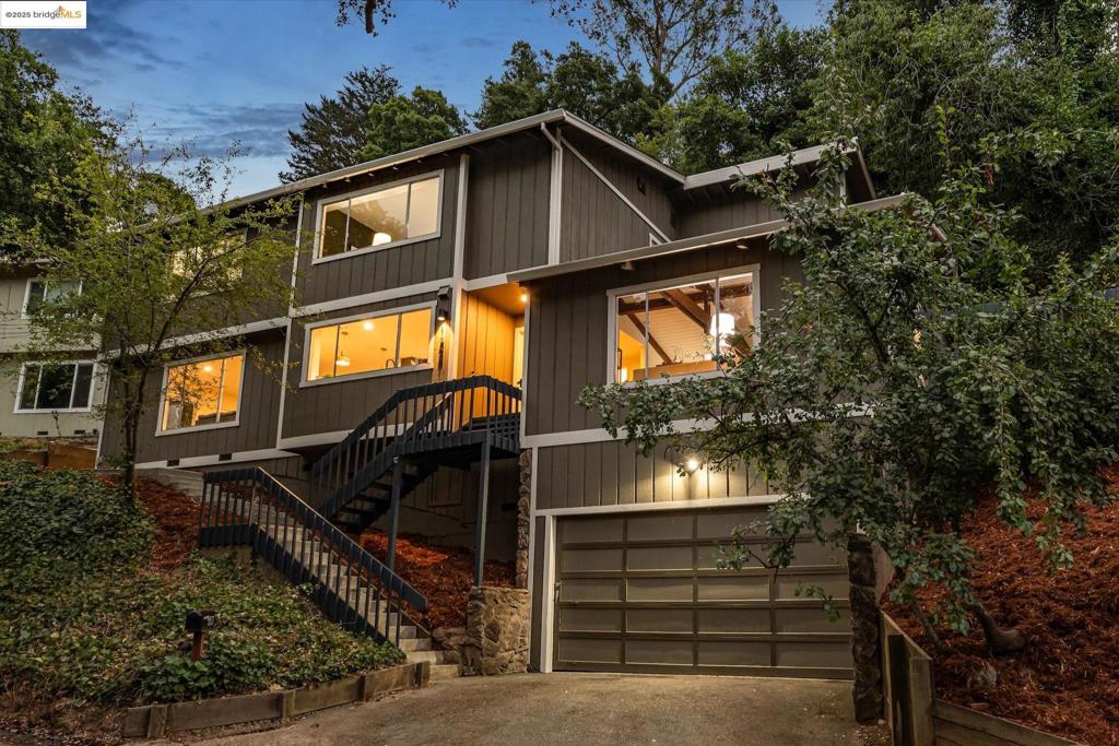 Beautiful contemporary home in Montclair’s sought-after Thornhill district is the best of both worlds, offering the quiet solitude of canyon living with Montclair Village’s shops & restaurants just minutes away. Nestled into the canyon and surrounded by mature trees and a variety of flora and fauna, 1801 Gouldin Rd is a natural sanctuary. This fab home has been beautifully updated throughout, blending mid-century charm and an open floor plan all bathed in natural light. Featuring 4 expansive bedrooms, 2 full bathrooms and 1 half bath across a spacious 2,658+/- sf, this serene retreat is a perfect balance of classic style and modern luxury while seamlessly integrating with the natural beauty that surrounds. A modern kitchen flows into an open dining room and living room area. The family room with soaring wood-beamed ceiling and floor-to-ceiling stone fireplace exudes bohemian charm. Step through sliding doors onto a spacious outdoor patio deck perfect for al fresco dining or even a potential hot tub location (buyer to verify). The second level features 4 spacious bedrooms and 2 full baths including fabulous owners ensuite with dual vanities, walk-in closet, and exterior deck. Just minutes to Montclair Village shops and restaurants, and easy commute options to the City.