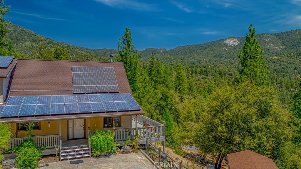 Solar-Powered Mountain Retreat with Stunning Views | 2471 Kokanee Rd, Mariposa, CA 95338
Welcome to your serene escape just south of Yosemite! This 2-bedroom, 2.5-bath, 2,017 sq ft cabinesque modern home in the peaceful Sierra foothills offers unmatched privacy, panoramic views, and sustainable living. Located halfway between Mariposa and Oakhurst, you're perfectly positioned for convenience and outdoor adventure.
Enjoy breathtaking moonrise views from the large wraparound deck, surrounded by oaks, pines, cedars, and thriving organic gardens bursting with cacti, flowers, and veggies. Inside, the home is both roomy and cozy, blending rustic warmth with modern updates.
Designed for both relaxation and entertaining, this home features:
- A spacious entertainment/office area complete with a large wine cooler, charming wooden bar, and ample glassware
- A cozy living room with forest views
- Original and newer furnishings available, making it turnkey-ready
- A 2+ car garage and a large built-in safe for peace of mind
But the real game-changer? The state-of-the-art solar system with battery backup—so efficient that PG\&E owes you most months. This is an ideal home for anyone looking to enjoy mountain living with modern, eco-conscious infrastructure.
Whether you're a nature lover, aspiring homesteader, wine enthusiast, or remote worker seeking tranquility, this property offers the best of all worlds.
Come see it in person—this Yosemite-adjacent retreat must be experienced to be believed.