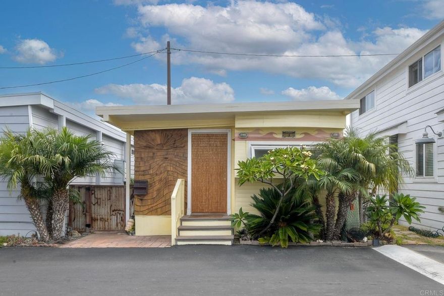 Do not miss this incredible opportunity to live steps to Beacons Beach in this restored mid-century gem in a prime Leucadia location! Step into coastal charm with this beautifully restored mid-century gem tucked away in the sought after beachside community near Beacons Beach. This classic 1bd/1bth beach bungalow features a spacious bedroom, open kitchen with eat-in dining,  a generous living area and an outdoor shower-perfect for rinsing off after a surf or beach stroll. Surrounded by lush tropical landscaping and nestled among million dollar homes, this property offers the ultimate in location and lifestyle. just steps to the sand and a short walk to local favorites including restaurants, wineries, coffee bars, breweries, surf shops, Farmer's Market and more! Whether you are searching for a full-time residence, a coastal getaway or an investment property, this rare opportunity delivers laid-back beach living in one of North County's most vibrant communities. Rentals are allowed and no traditional property tax or HOA fees. Space rent $2,094/month.