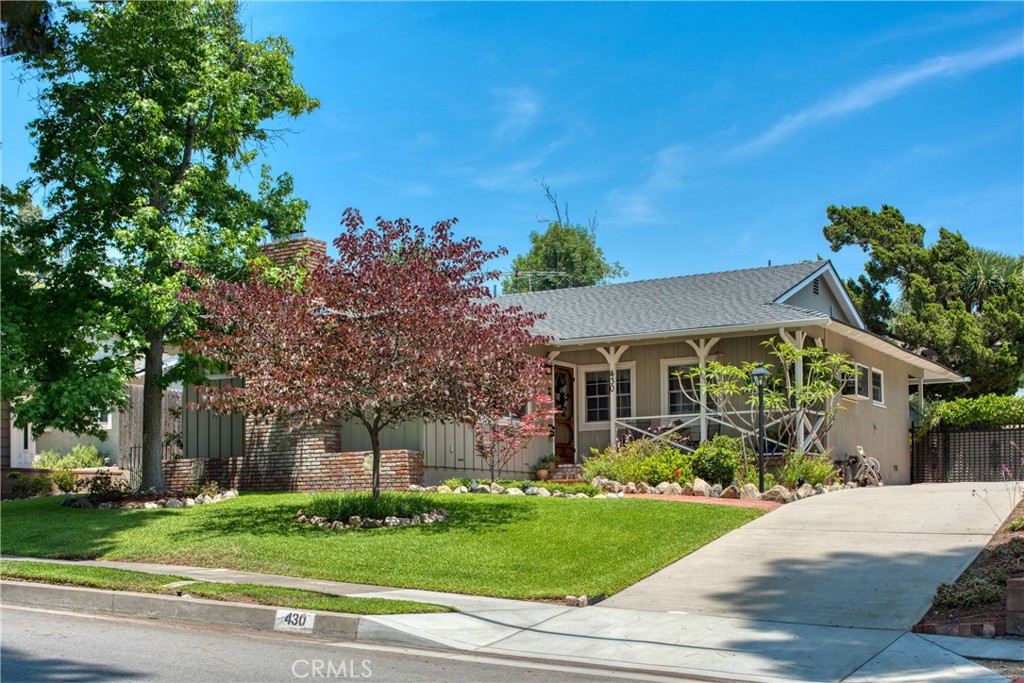 Discover this charming single-level home, ideally situated on a sprawling lot in the scenic foothills of Monrovia. Step inside to a welcoming living room, complete with a cozy fireplace, perfect for cooler evenings. The kitchen is equipped with stainless steel appliances, including a gas cooktop, range hood, and dishwasher, and flows seamlessly into the dining area. For more expansive entertaining, the family room offers additional dining space and direct access to the expansive yard. The primary bedroom is a spacious sanctuary featuring generous closet space and an adjoining bathroom with a dual sink vanity. Two additional bedrooms and bathrooms provide ample accommodation. This home also boasts a dedicated laundry area, gleaming hardwood floors, and central air and heat for year-round comfort. A two-car garage offers convenience and extra storage. The true highlight of this property is the incredible yard, a private oasis designed for relaxation and enjoyment. Dive into the sparkling pool and spa on warm summer days, or envision your dream garden or entertainment area in the versatile, rustic space. Enjoy the best of Monrovia living with hiking trails just moments away and a short distance to the vibrant shops and restaurants of the city. This home perfectly blends comfortable living with an exceptional outdoor lifestyle. Contingent upon the seller identifying and closing concurrently on a suitable replacement property.