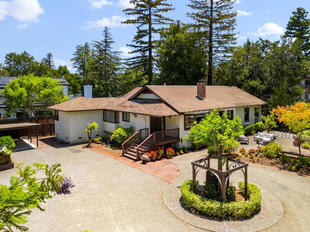 Don't miss this rare opportunity to own a 20,000+ sq ft lot in the heart of North Los Altos - one of Silicon Valleys most coveted neighborhoods. Whether you're dreaming of building your custom estate or expanding the current home, this level, oversized lot offers incredible potential and flexibility. Located on a quiet, tree-lined street just a short stroll to downtown Los Altos, you'll enjoy the convenience of top-rated restaurants, cafes, boutique shopping, and community parks-all within minutes of your front door. Families will love access to highly rated Los Altos schools (Buyer to verify) and the easy commute to major tech hubs like Google, Apple, Meta, and LinkedIn. This is a perfect location for those looking to enjoy a suburban lifestyle with quick access to the best of the Bay Area.