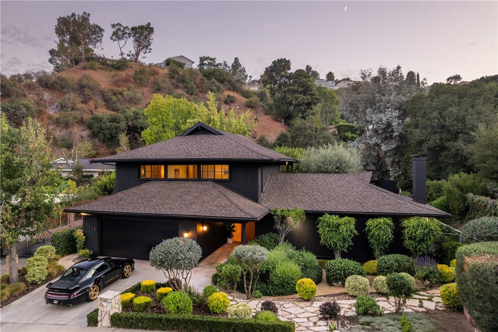 Don't miss this stunning, fully re-imagined home nestled in the coveted hills of Encino. Boasting 4 spacious bedrooms and 4 luxurious bathrooms, this home exudes elegance and sophistication. The formal dining room sets the stage for memorable gatherings, while the custom white oak flooring and bespoke cabinetry throughout add timeless charm. Every detail has been thoughtfully curated, from the custom white oak interior and exterior doors to the high-end Bosch built-in appliances. The kitchen features exquisite honed Calcutta marble countertops and a dual-zone refrigerator, perfect for culinary enthusiasts. Throughout the home, you'll find wallpaper by the renowned House of Hackney, adding an artistic touch. The primary bedroom is illuminated by a stunning Herman Miller light fixture, and the entry is graced by a show-stopping Mooie Home light.
For ultimate comfort, this home is equipped with dual HVAC systems and Fleetwood doors that seamlessly blend indoor and outdoor living. Every fixture is meticulously chosen, with all hardware from the luxury brand Newport Brass.
Step outside to your private outdoor oasis, where you'll find a built-in grill and outdoor fridge perfect for entertaining. The resurfaced, heated pool invites you to relax and unwind, while the built-in seating and fire pit create an inviting space to enjoy the serene surroundings year-round. This home effortlessly blends luxury, comfort, and design for the ultimate living experience.