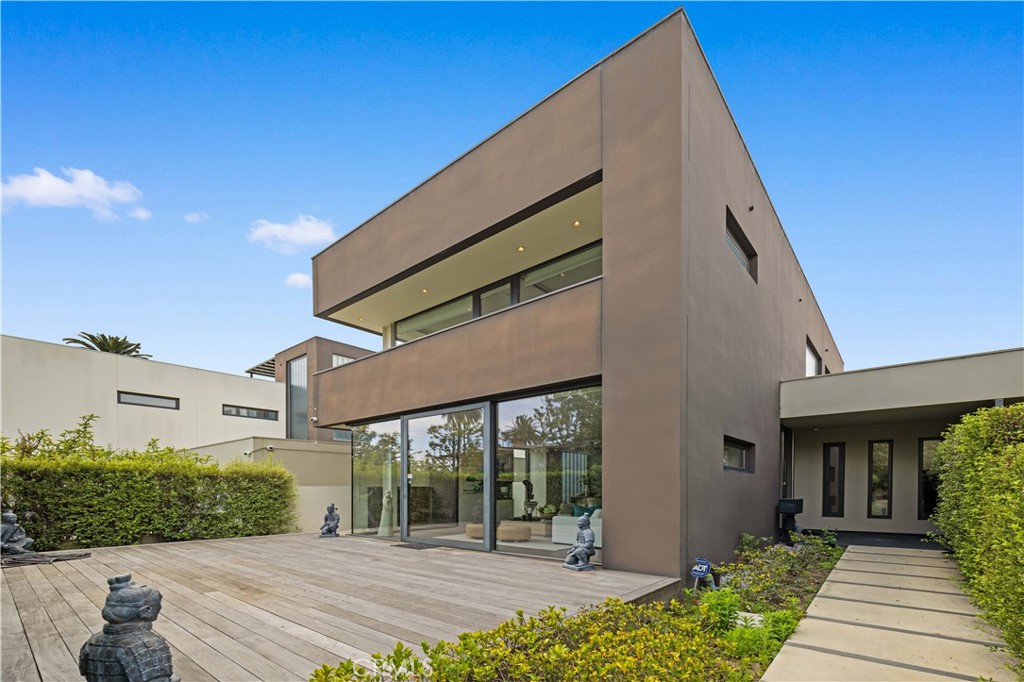 Welcome to this dream masterpiece with 5 bedrooms and 5 bathrooms in the coastal Bluff Park neighborhood of Long Beach. An exclusive coastal haven that perfectly blends sophisticated modern design with the tranquil beauty of the Pacific Ocean. Build in 2008, 3900 sq.ft. living spaces. The open floor plan effortlessly combines the kitchen, dining, and living areas into one expansive space. The floor-to-ceiling windows bring sunshine and natural light to every corner of the house. One large bedroom on the ground floor, the modern glass walkway isn’t just a functional architectural feature — it’s a work of art. Central AC, heated floors, and a large patio, a detached two car garage, Master bedroom has a private balcony with ocean views. Extra bonus room can be a multifunctional use. The expansive rooftop offers 180-degree ocean views, it’s the best place for partying and entertaining. Moreover, seller finance is available for this property. Minutes away from Belmont Shore’s shopping and dining. Must see, It’s a combination of coast life with the modern convenience of city life.