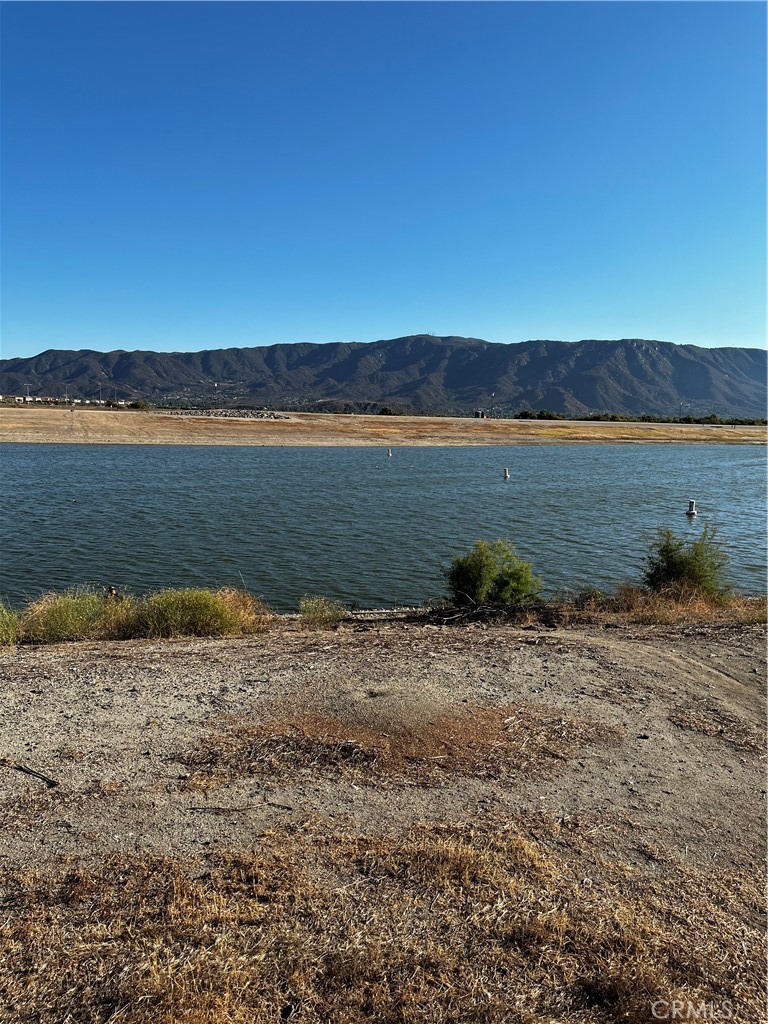 "Lake Elsinore" Welcomes you to a beautiful city with plenty of entertainment, stander mountains to explore, bike around the city, go fishing on the lake or go boating or much more. The property is flat and has 4,356 sf usable. Utilities are located nearby. This is the perfect lot for building your home or buying as an investment. We have two more properties one is right next door and has 4,350 sf the other is on this same street. The property is very centrally located and is close to the freeway 15, shopping centers, schools and the stadium where you can appreciate the splendor of July 4th lights.