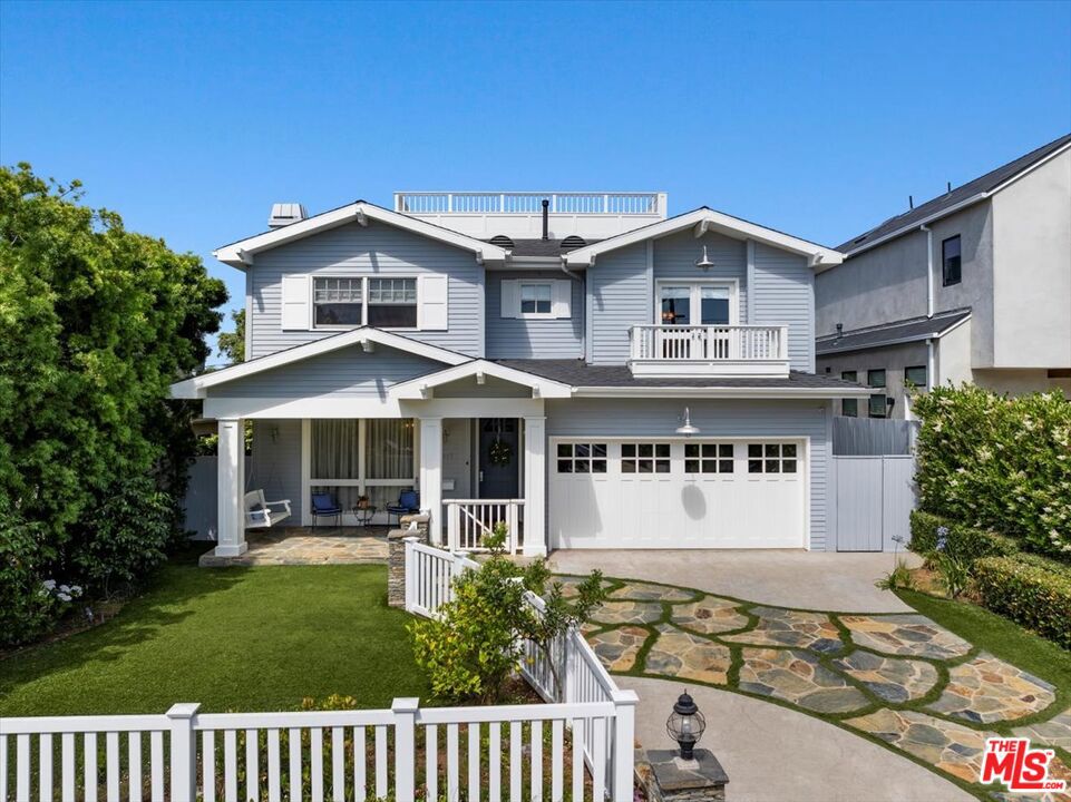 This breathtaking two-story Cape Cod almost seems transplanted directly from the shores of the Atlantic to the west coast's beautiful tree lined streets neighboring the Village of Pacific Palisades just up the hill from the renowned Will Rogers State Beach. Built with extraordinary custom craftsmanship, the term "attention to detail" is not lost here. Your dream home welcomes you with a beautiful natural stone driveway, a gated yard and a lovely porch swing overlooking the charming front garden. An ideal floor plan seamlessly flowing from one space to the next begins with wainscoted walls into a formal front living room adorned with a graceful coffered ceiling and marble-surrounded fireplace with a tastefully styled substantial mantel. The adjacent, sizable dining room with built-in cabinetry will allow you to entertain guests at many elegant dinner parties. The opposite side of the home provides an oversized multipurpose room perfect as an office, playroom, or main level guest bedroom complete with its own full bathroom. The gourmet kitchen boasts state-of-the-art Viking appliances, built-in Meile espresso machine, glass embellished cabinetry, an oversized Carrera marble-topped center island and a built-in breakfast nook spilling into a relaxing family room with another warm and cozy fireplace. The delightful rear outdoor space features a pergola covered patio with overhead heaters, a glowing firepit with integrated seating, a gas bbq island, and a soothing spa with a waterfall cascading over a glistening stone-wall backdrop. A grand, light filled staircase with a spectacular, grand luminaire overhead invites you upstairs to four spacious bedrooms. The bright primary suite sports a beamed vaulted ceiling, a reading area, an enviable walk-in closet and a luxurious sparkling marble surfaced bathroom with heated floors. Capping this incredible home is an unexpected expansive rooftop deck presenting 360 degree views of the beautiful blue ocean waters of the Santa Monica Bay, down to the hills of Palos Verdes and around to the mountains and canyons to the east. Come discover your new home!