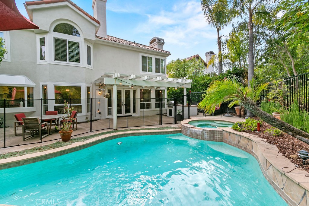 Available September 6th! Situated in the desirable Vistara neighborhood of Marina Hills on a private cul-de-sac, this expansive 4-bedroom, 4.5-bathroom POOL home offers over 3,600 square feet of beautifully designed living space. The open floor plan features a formal living room with fireplace, elegant dining area, and a spacious family room with a cozy fireplace. The gourmet kitchen includes a breakfast nook, high-end stainless steel appliances, and tile flooring, with wood flooring throughout the main living areas. The home also offers a versatile bonus room, 1st floor guest bedroom with ensuite bathroom, and a luxurious primary suite complete with a fireplace, walk-in closet, and spa-like bath. Enjoy a private backyard retreat with a sparkling pool, relaxing spa, and patio areas—perfect for outdoor entertaining. Additional highlights include a 1st floor powder room, a laundry room with washer and dryer included, and an attached three-car garage offering ample parking and storage with TWO EV car chargers! The community is resort-like living in Marina Hills with tennis and pickleball courts, community pool, and clubhouse. Located close to scenic trails, parks, shopping, and dining, with access to award-winning Capistrano Unified schools, this home blends comfort, style, and convenience in one exceptional lease opportunity.