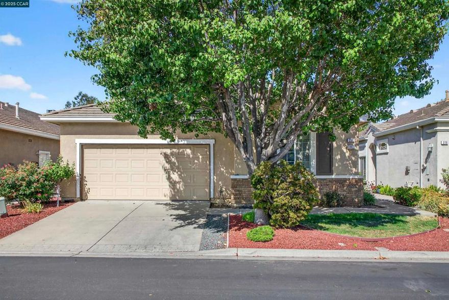 Discover comfort and convenience in this well-maintained 2-bedroom, 2-bathroom home offering 1,048 sq ft of living space. Located in a desirable gated senior community, this property features an open floor plan, an eat-in kitchen with classic tile countertops, and laminate flooring in the kitchen and hallway. Enjoy year-round comfort with central AC and heat, dual-paned windows, and newly installed ceiling fans in the living room and bedroom. The attached 2-car garage provides secure parking and extra storage. Relax or entertain in the backyard with a patio area and space for your own garden. This home is ideally located near the community pool and tennis courts, and just minutes from Brentwood Golf Club, local shopping, and freeway access.